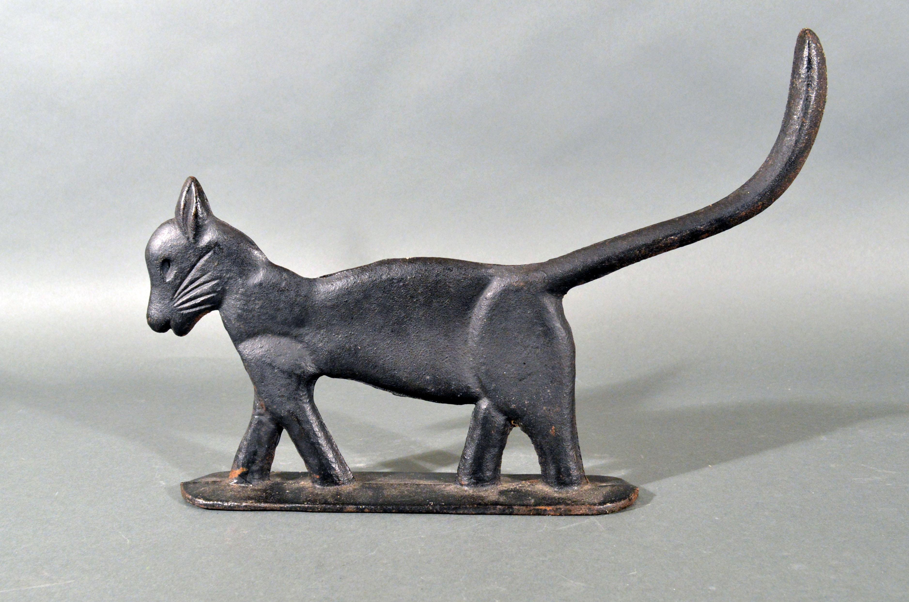 American cast iron sculpture or boot scrapper of a cat,
circa 1920s
 

The lovely American cast iron rare striding cat boot scraper in original black paint has a silhouette of a flattened, full-body form of a cat with a dramatic profile: it's