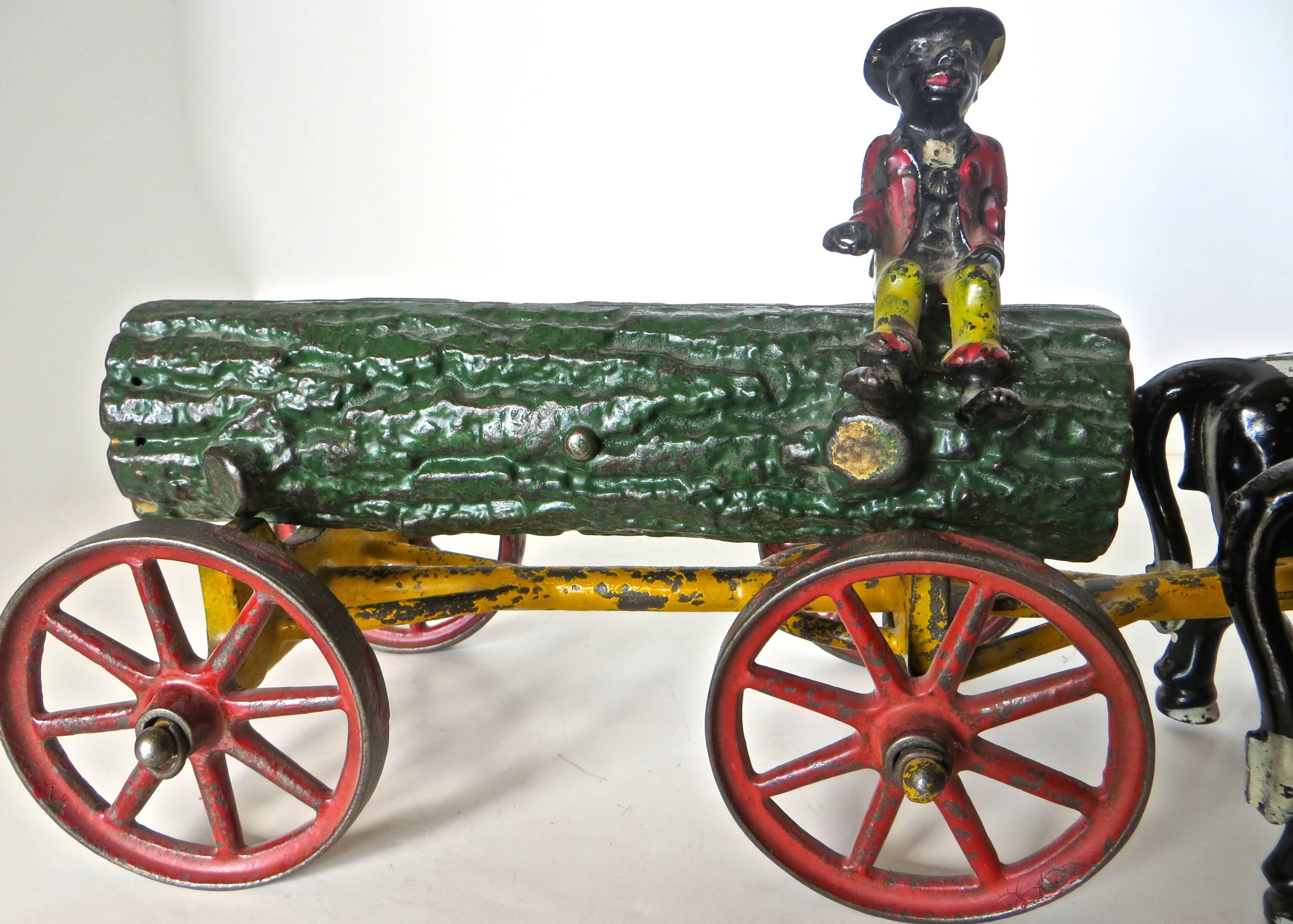 Artisanat Jouet américain en fonte:: bûche tirée par un bœuf sur un chariot avec cavalier par Hubley