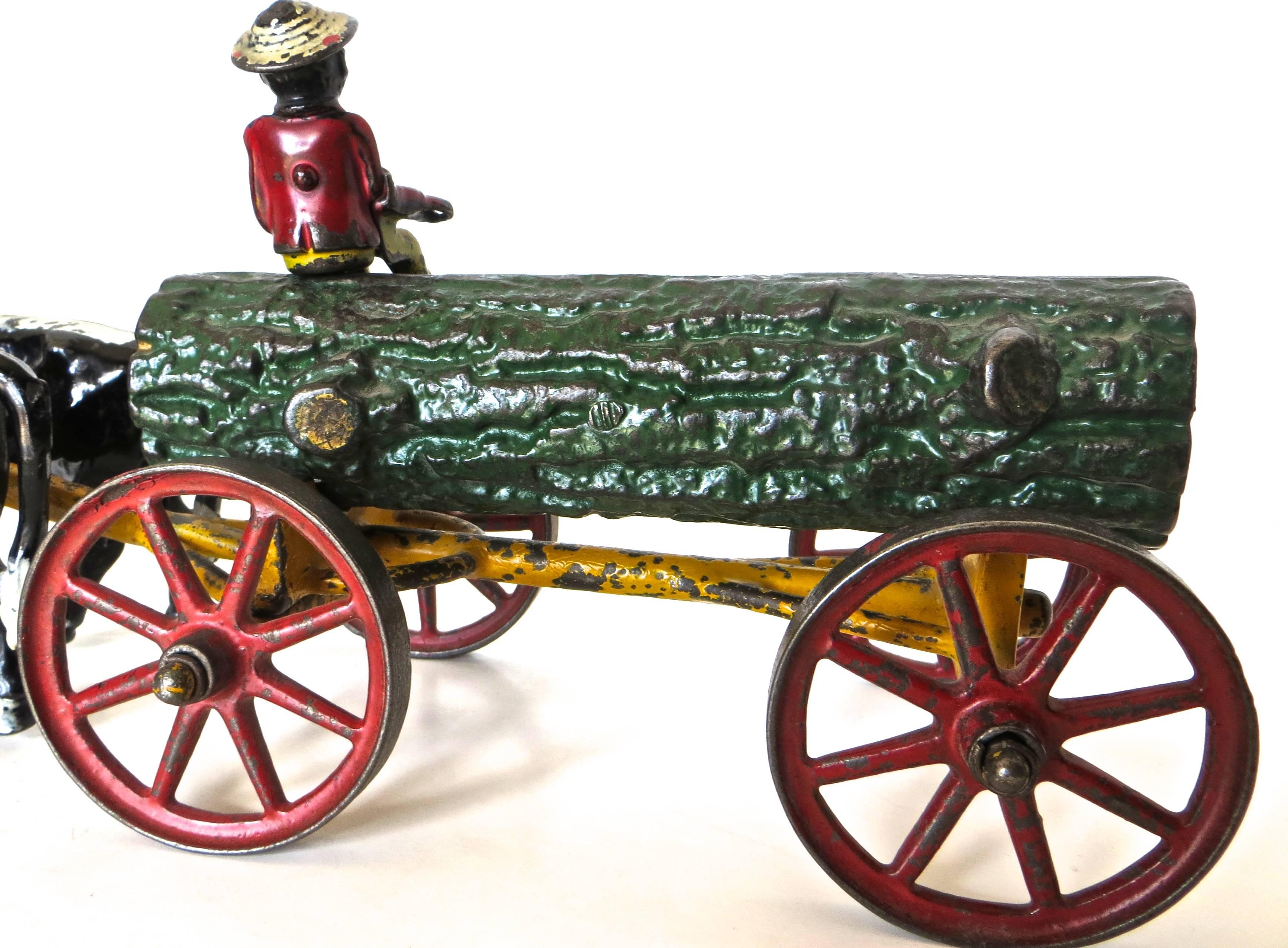 Folk Art American Cast Iron Toy, Oxen Drawn Log on Carriage with Rider by Hubley