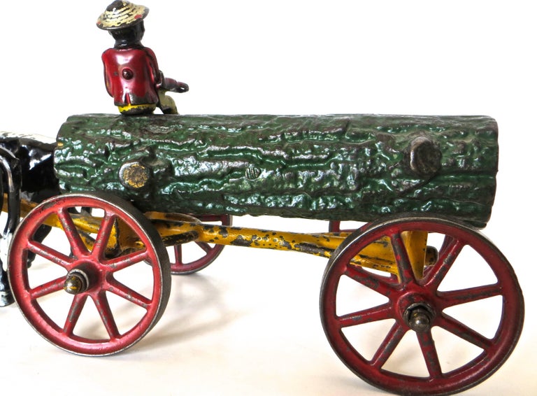 American Cast Iron Toy, Oxen Drawn Log on Carriage with Rider by Hubley