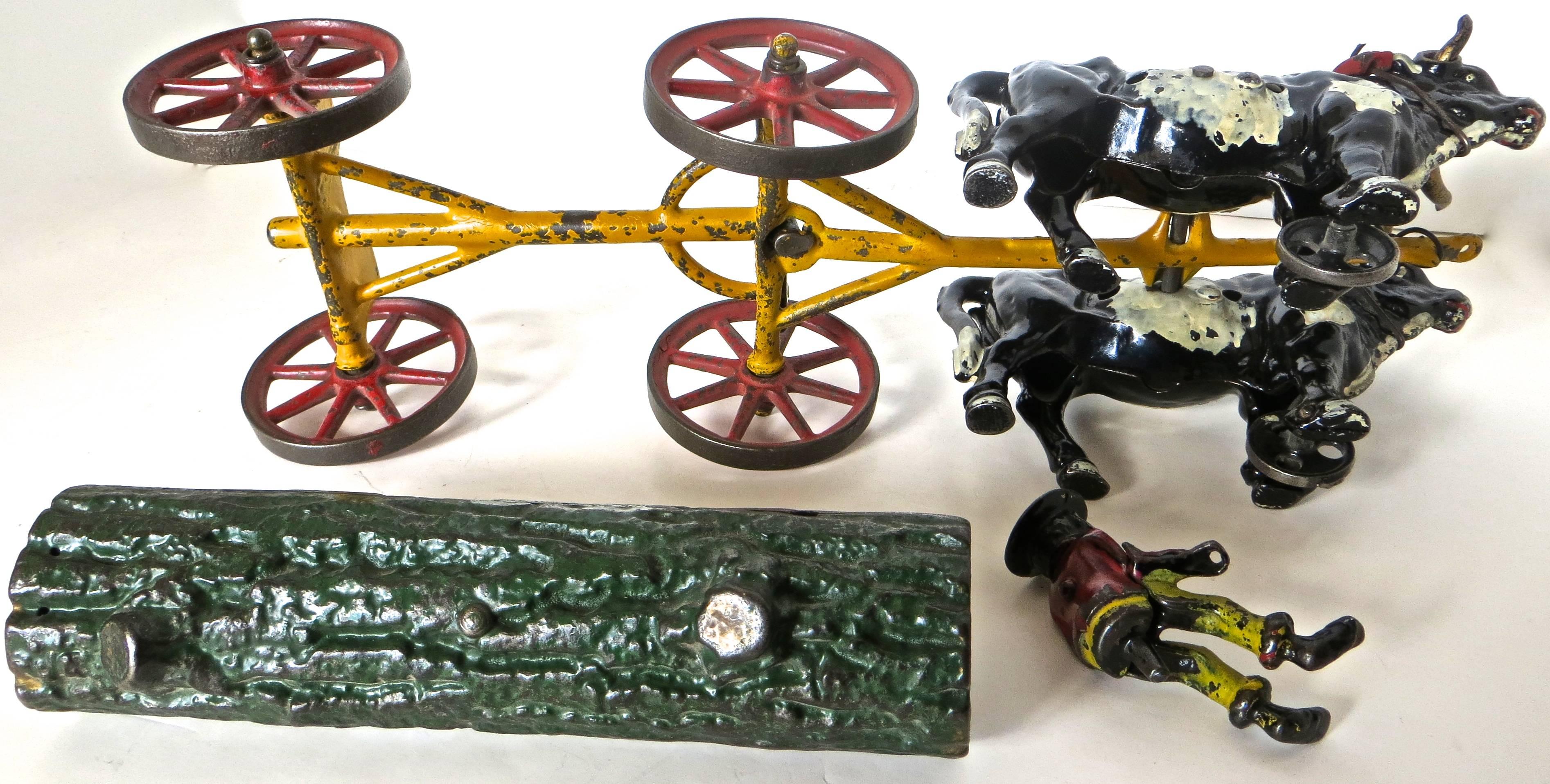 Early 20th Century American Cast Iron Toy, Oxen Drawn Log on Carriage with Rider by Hubley