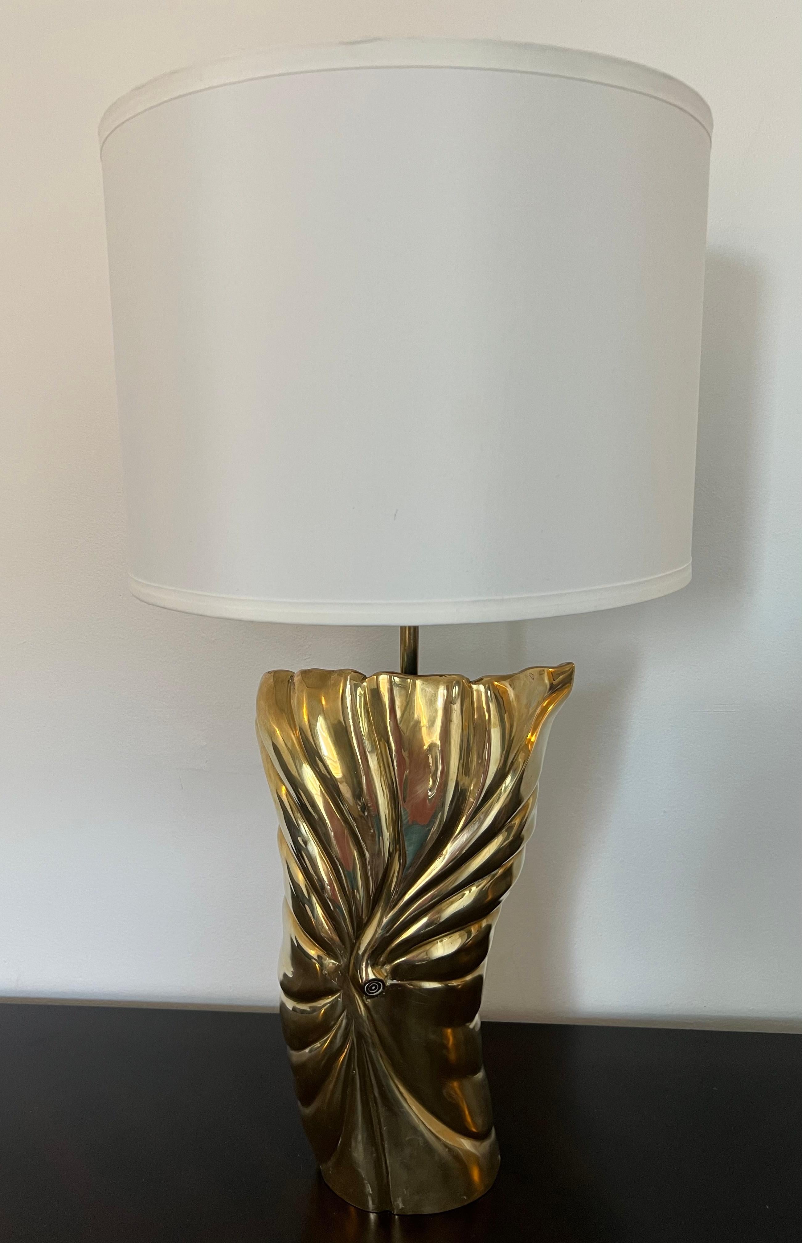 A 1980s American sculptural polished bronze table lamp with double sockets and silk cord by Chapman lighting. Rewired.