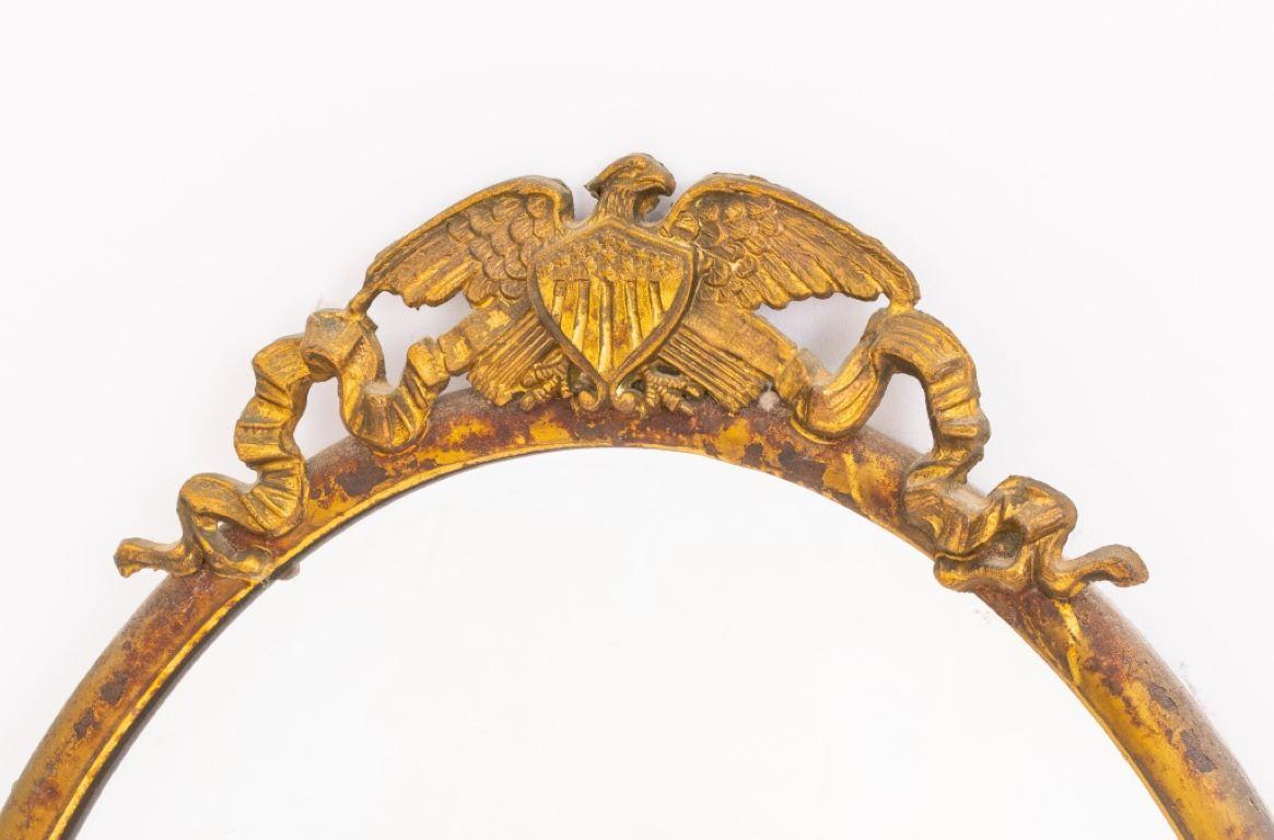 American chased gilt metal medaillon mirror, patriotic eagle with coat of arms motif to top. 