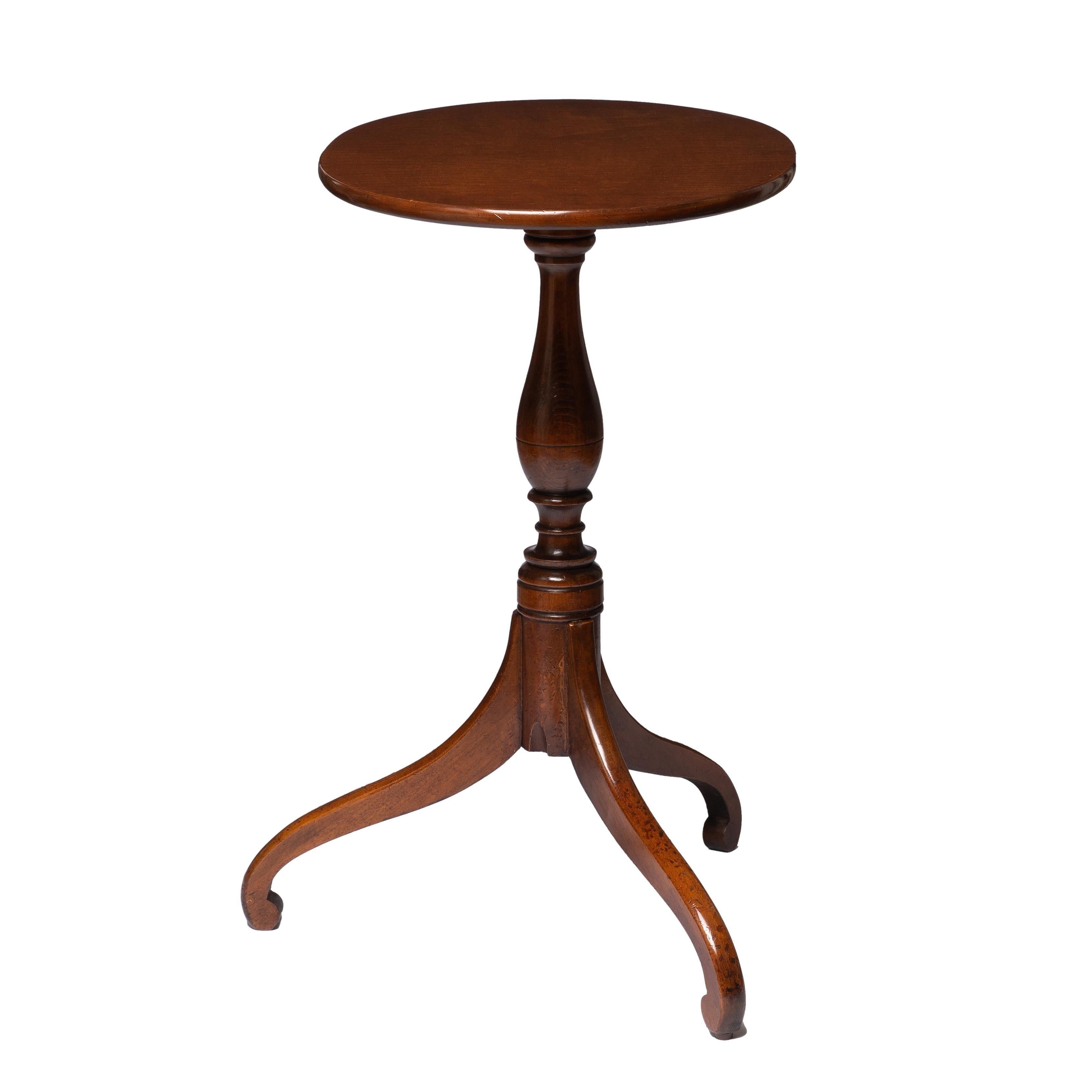 American cherry Hepplewhite tripod spider leg candle stand with an exceptionally figured curly maple veneered oval top.

American, Connecticut Valley, circa 1800.