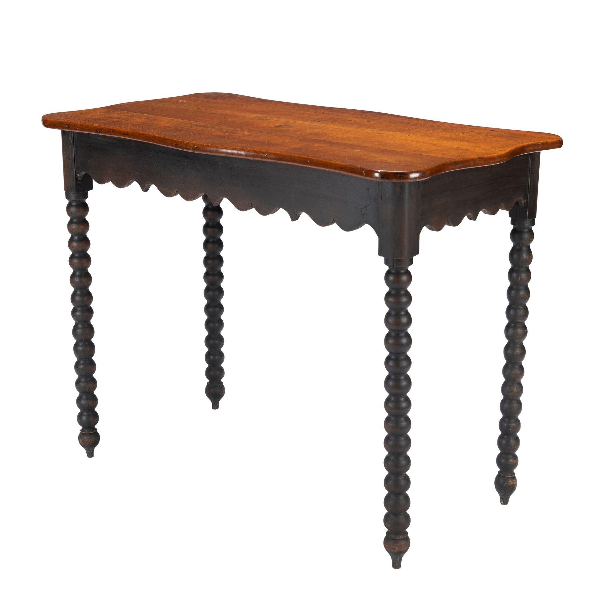 Cherry American cherry wood work table with scalloped apron and spool turned legs, 1835