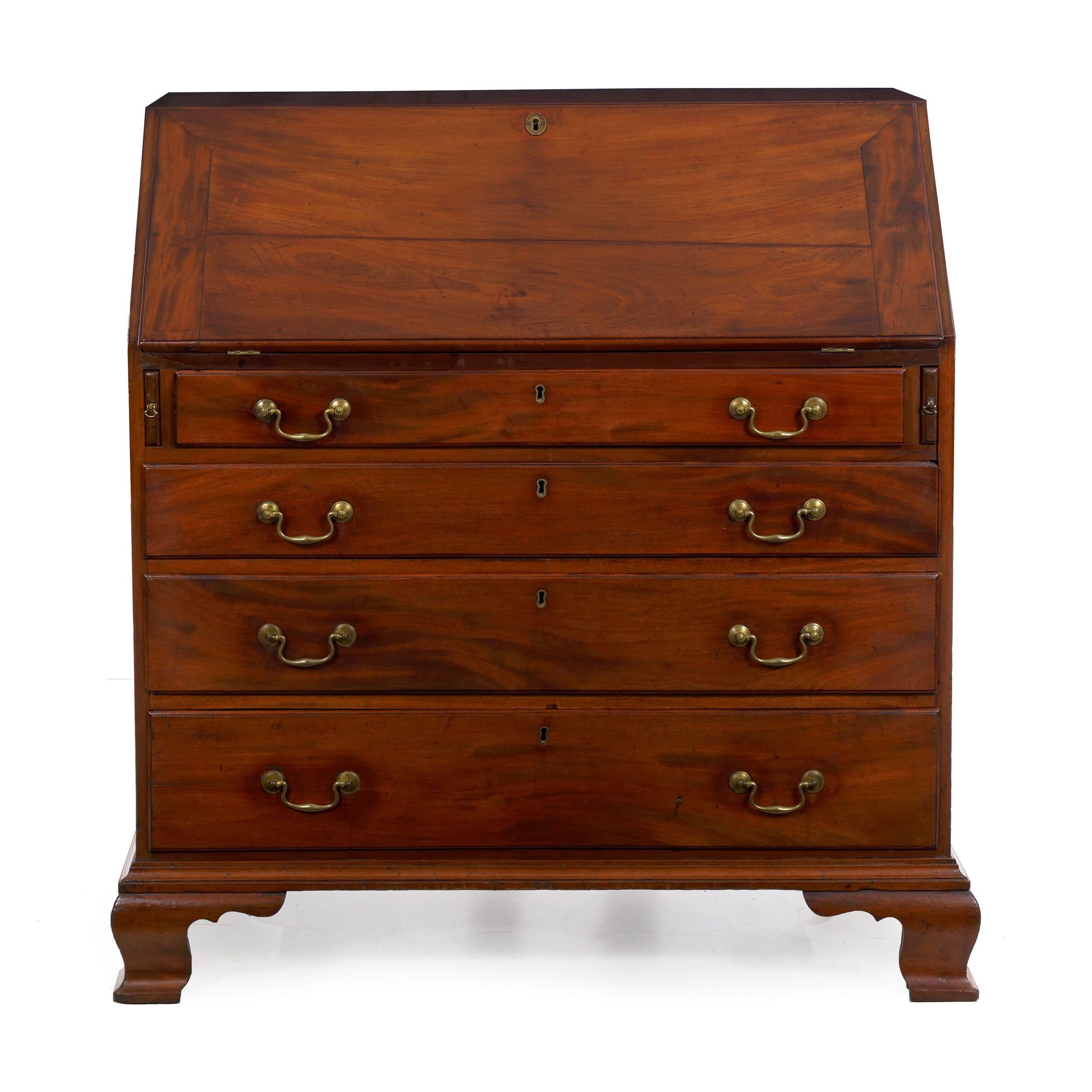 An attractive period slant-front writing desk from the Mid-Atlantic States circa 1790, it is likely a product of Pennsylvania with an overall stoic unembellished form. It was designed strictly as a functional and useful object for managing the home