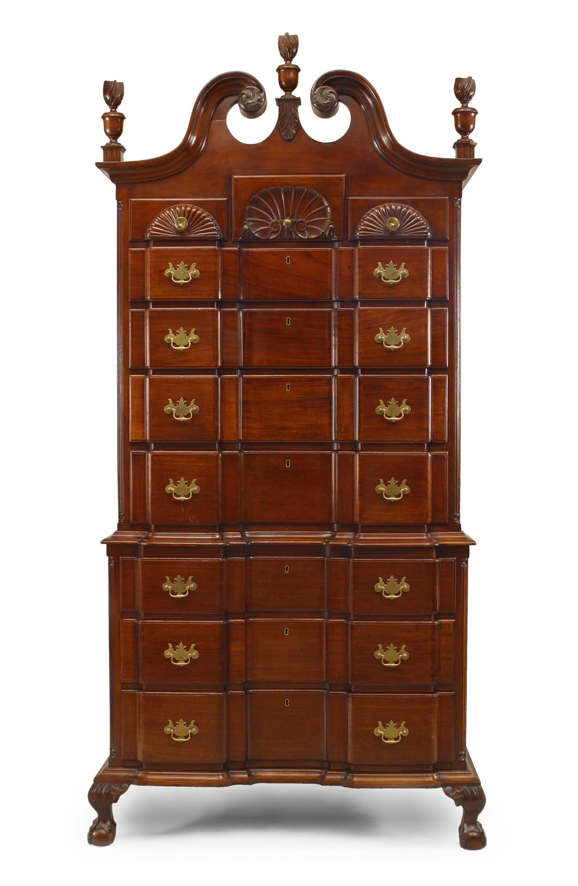 American Chippendale style (Early 20th Century) mahogany chest on chest cabinet with 7 drawers below 3 shell carved small drawers with flame form finials and broken pediment top.
  