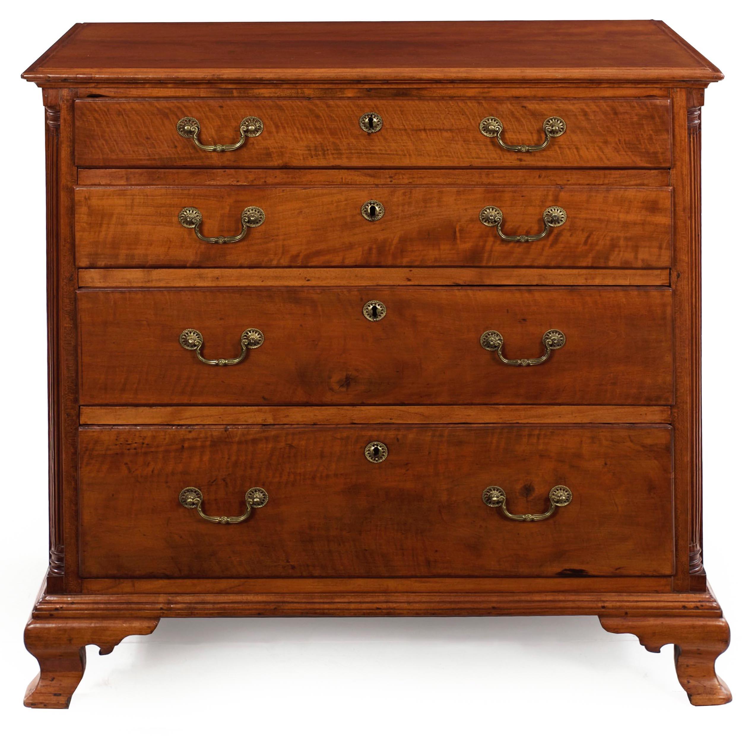 A product of the New England States from the last quarter of the eighteenth-century, this very attractive Chippendale chest of drawers features solid figured maple primary woods finished in a glowing shellac. The top is crafted using two solid maple