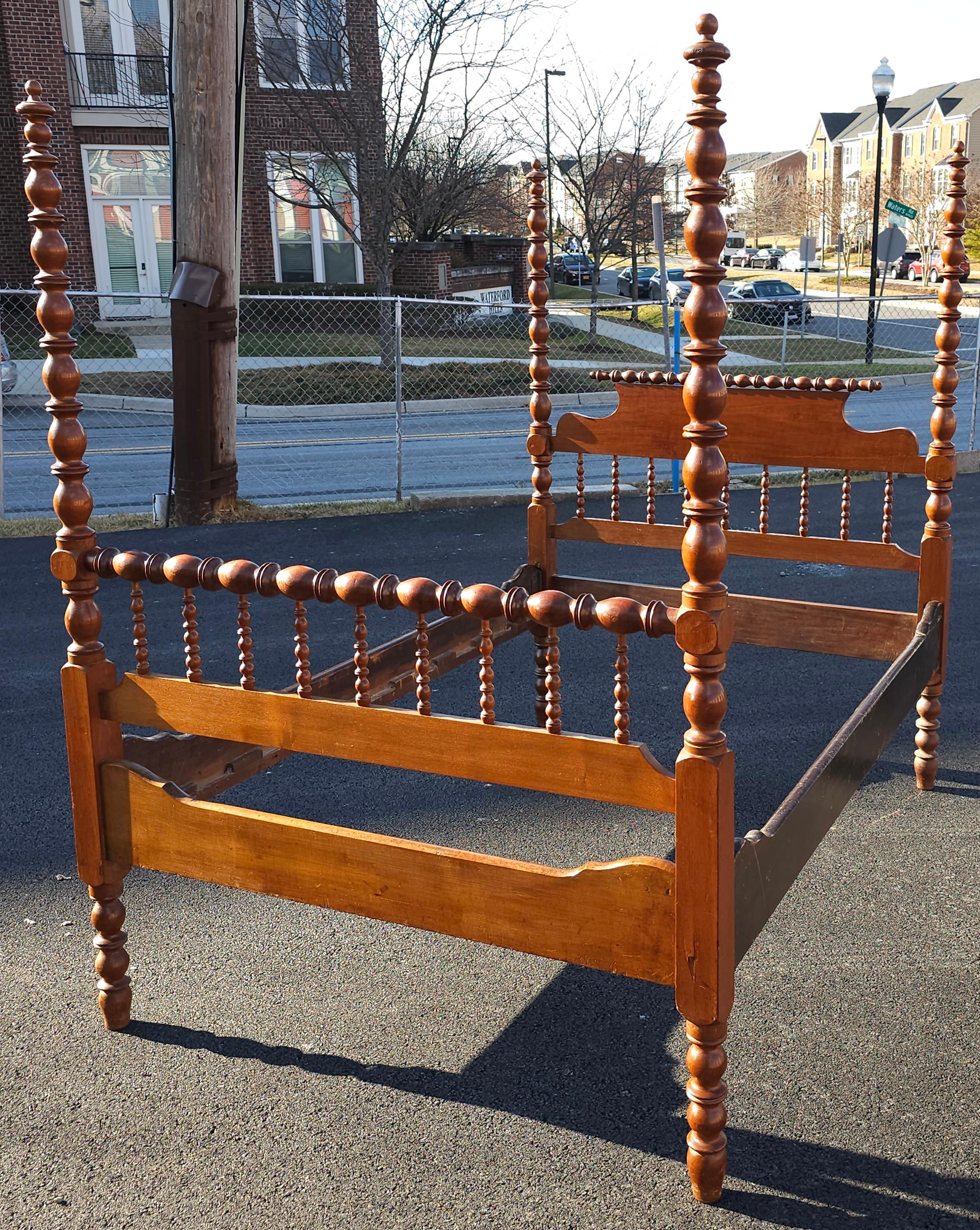 An American Classical Bobbin Turned Spindle Fruitwood Poster Full Size Bed Stead. Comes with slats. Measures 54