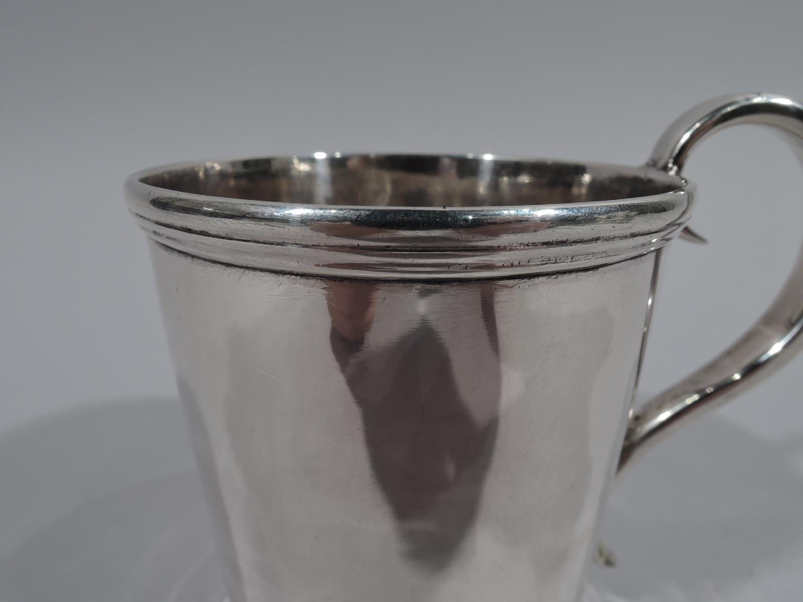 American classical coin silver baby cup. Straight and tapering sides, reeded rim and base, and S-scroll handle. Lots of room for engraving. Fully marked including phrase “Pure Silver Coin” and retailer’s stamp for Lincoln & Reed, who were active in