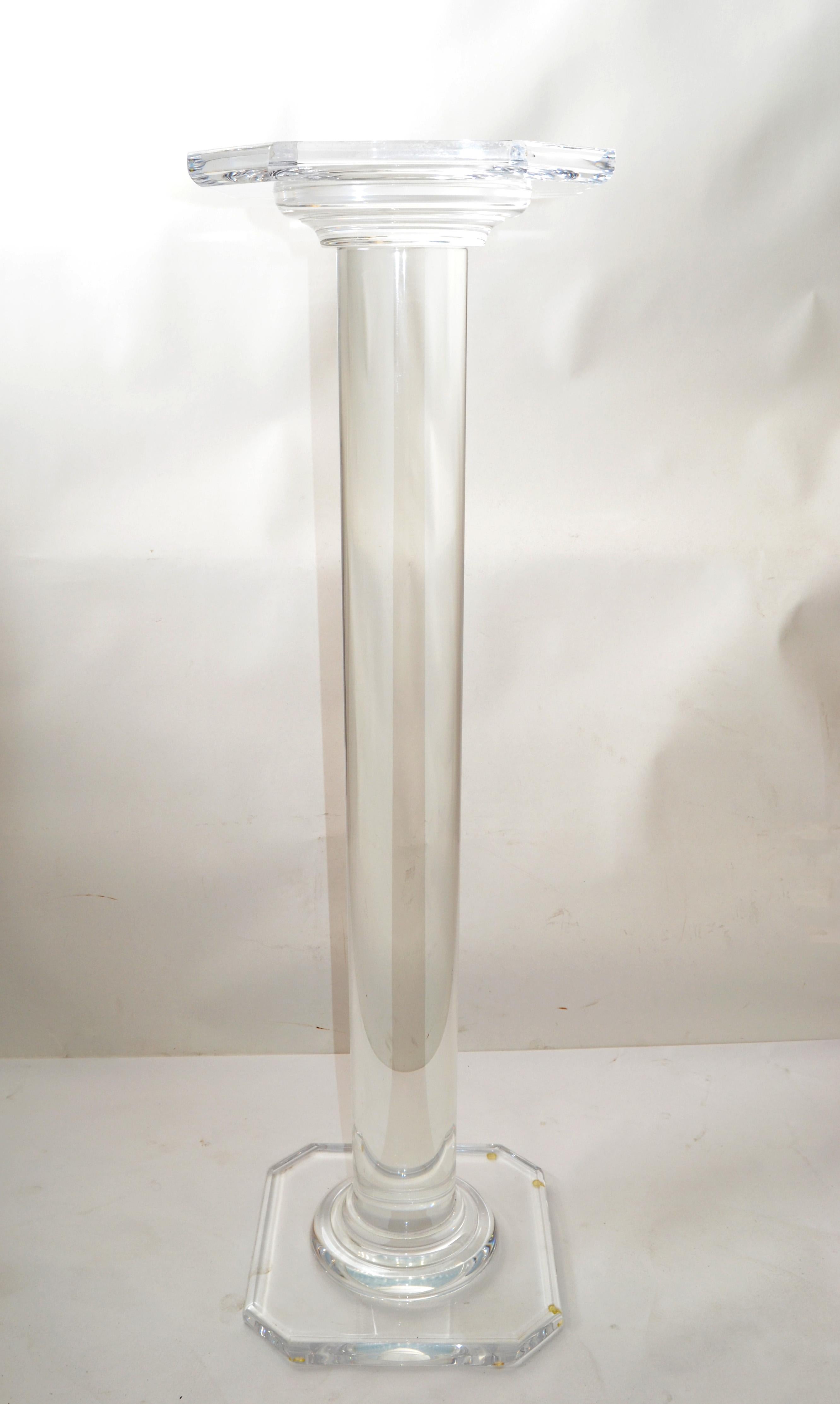 Mid-Century Modern transparent pedestal, columns, sculpture stand in Lucite.
Tubular middle part & square faceted top and base makes this pedestal so interesting. 
Stunner done and useful to display your favorite pieces of art.
 