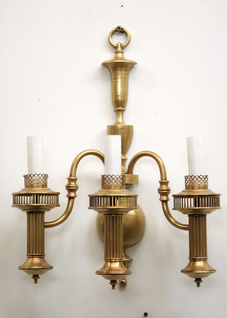 American colonial solid brass wall sconce with 3-tier oil lamp style electric sockets.

3-available.