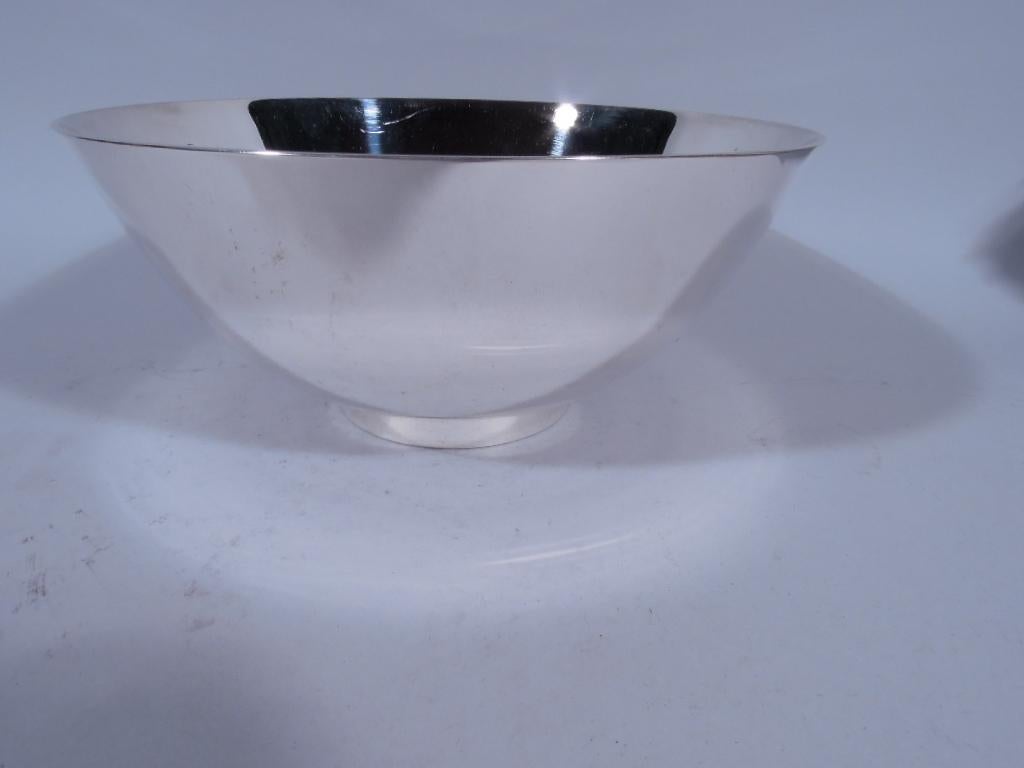 American Colonial Revival sterling silver bowl. Made by Tiffany in New York. Bowl has curved sides and straight circular foot. Spare historic design that works equally well in Modern interiors. Fully marked including pattern no. 19750 (first