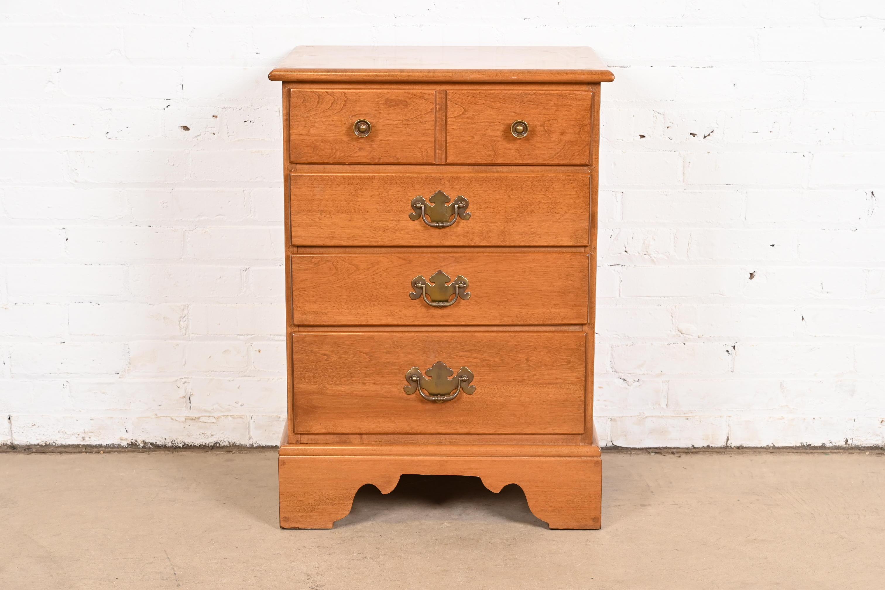 A gorgeous American Colonial, Georgian, or Chippendale style four-drawer nightstand or chest of drawers

USA, Circa 1970s

Carved solid maple, with original brass hardware.

Measures: 20