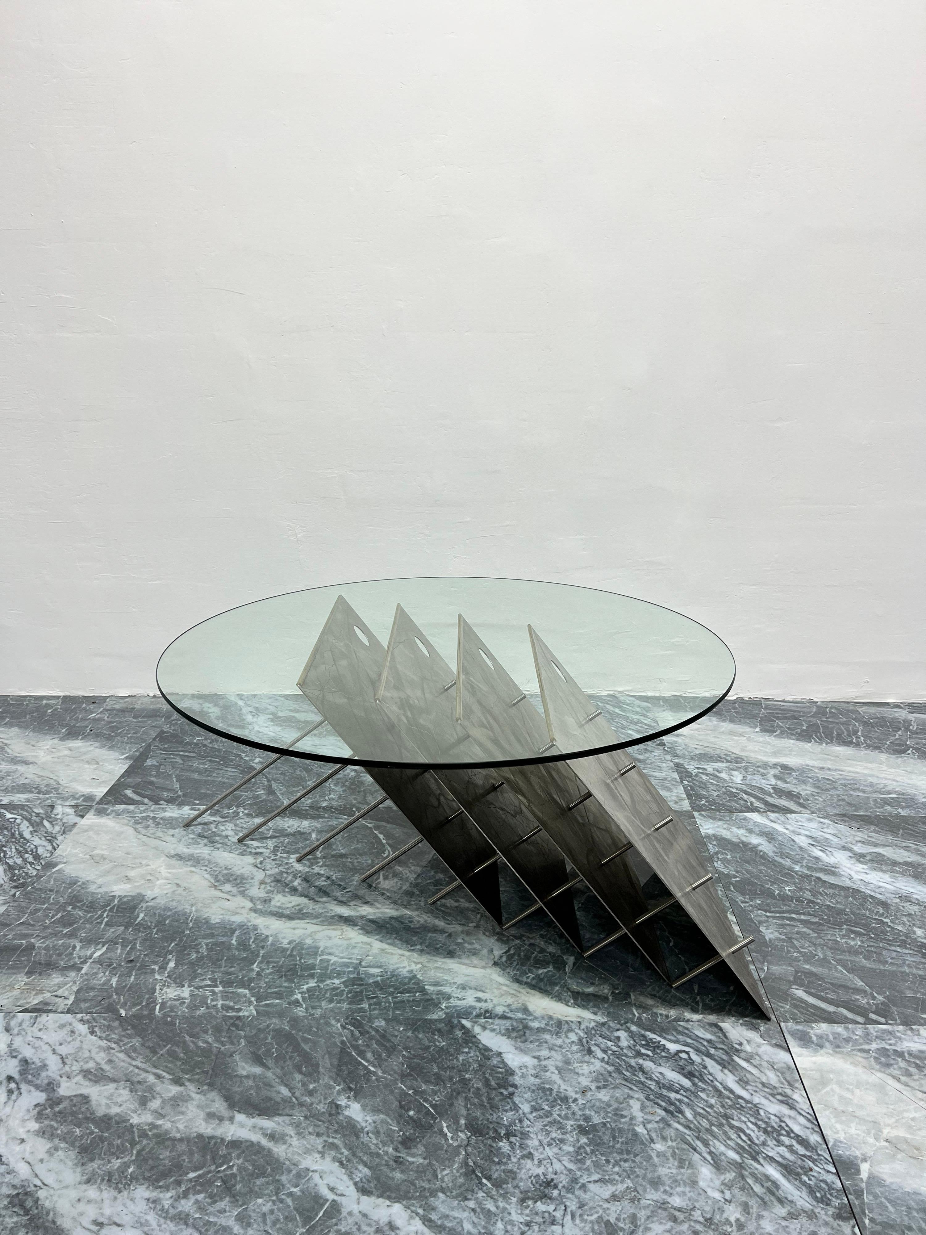 Contemporary brushed steel with metal rod coffee table and circular glass top. Custom made in the 1990s by unknown artist.

Glass Dimensions:
D 36