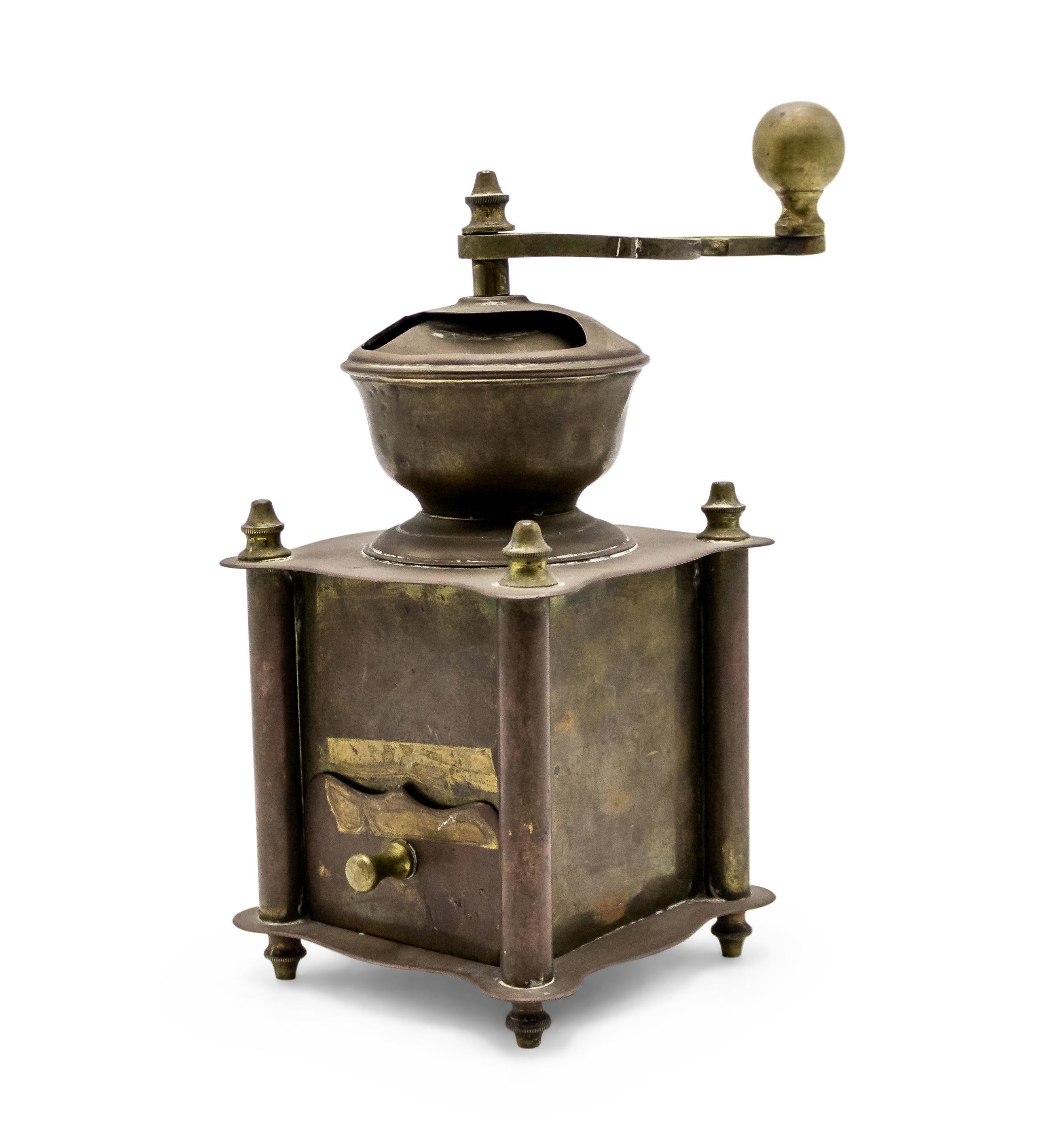 American Country-style (19th Century) brass coffee grinder with etched floral design.