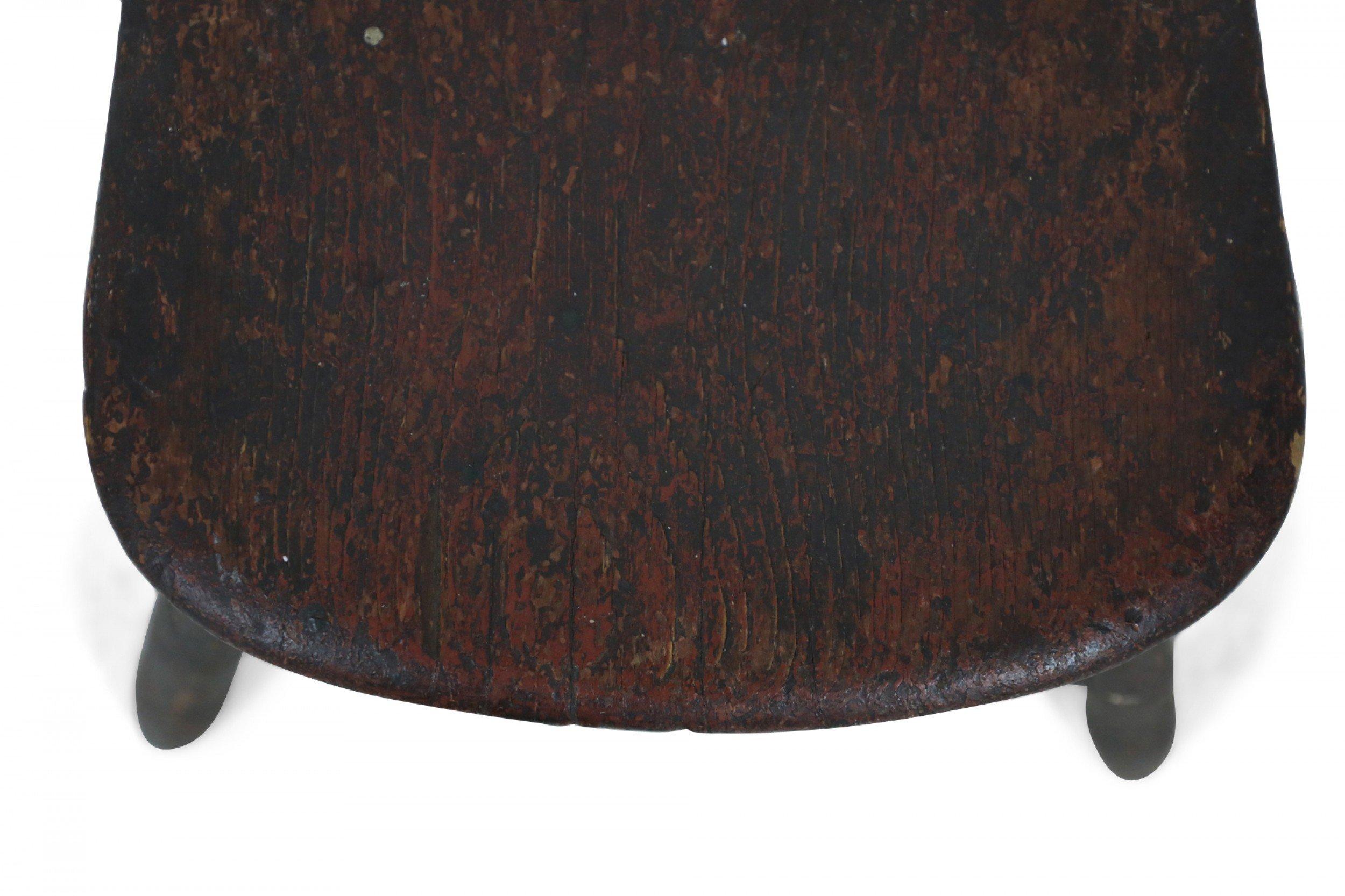 American Country-style child sized wooden Windsor chair with a fan back and dark brown painted finish.
 