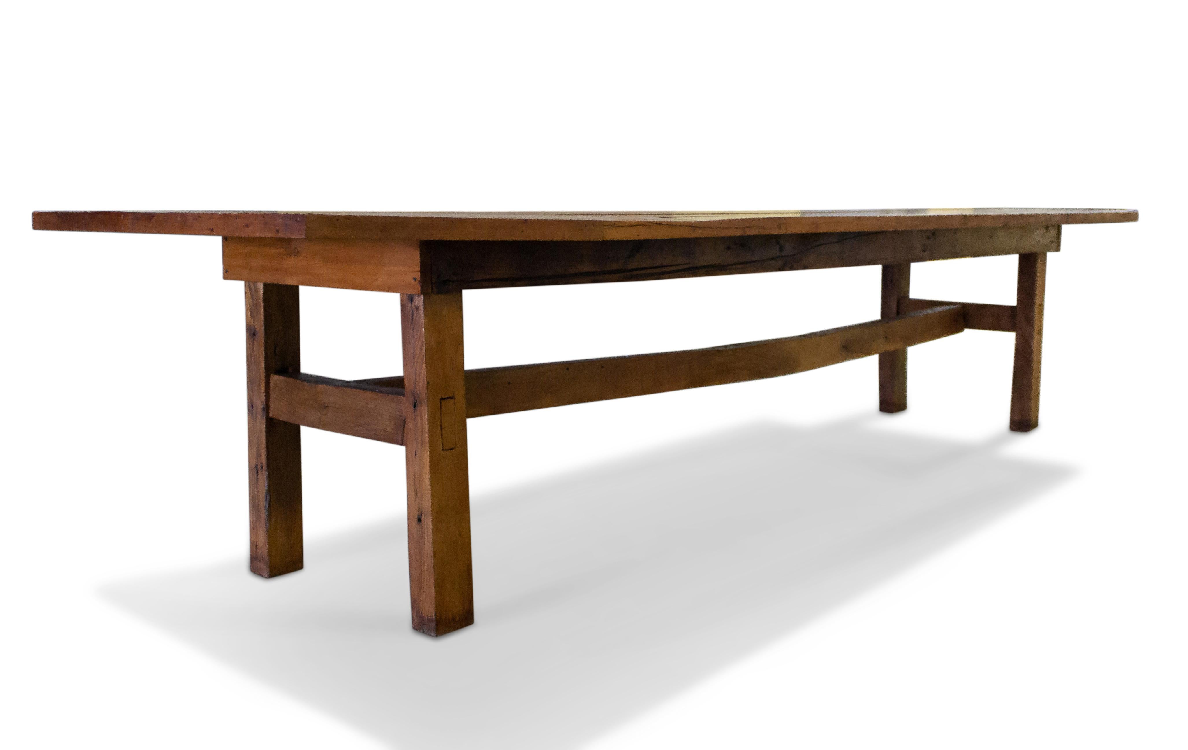 American Country style large pine plank top dining / refectory table with an oak stretcher base.