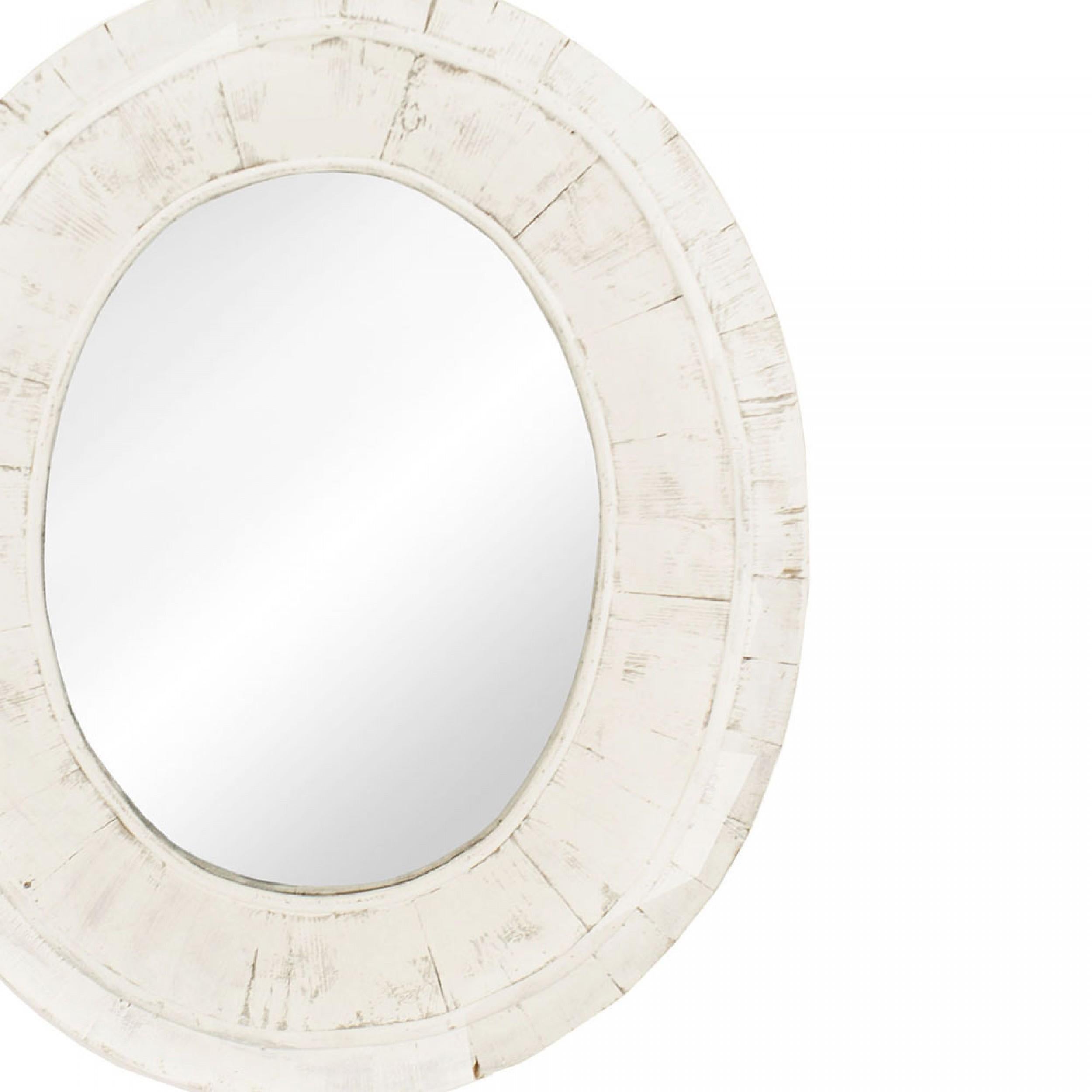 American Country (19/20th Century) oval wall mirror with a thick frame with a weathered white painted finish.