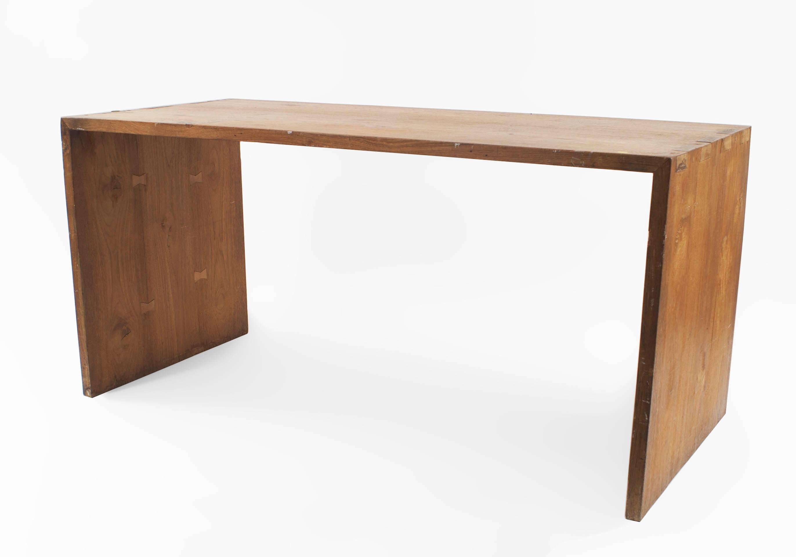 Post-War minimal dark stained pine work table desk with dovetail construction connecting the top to the side panels.
