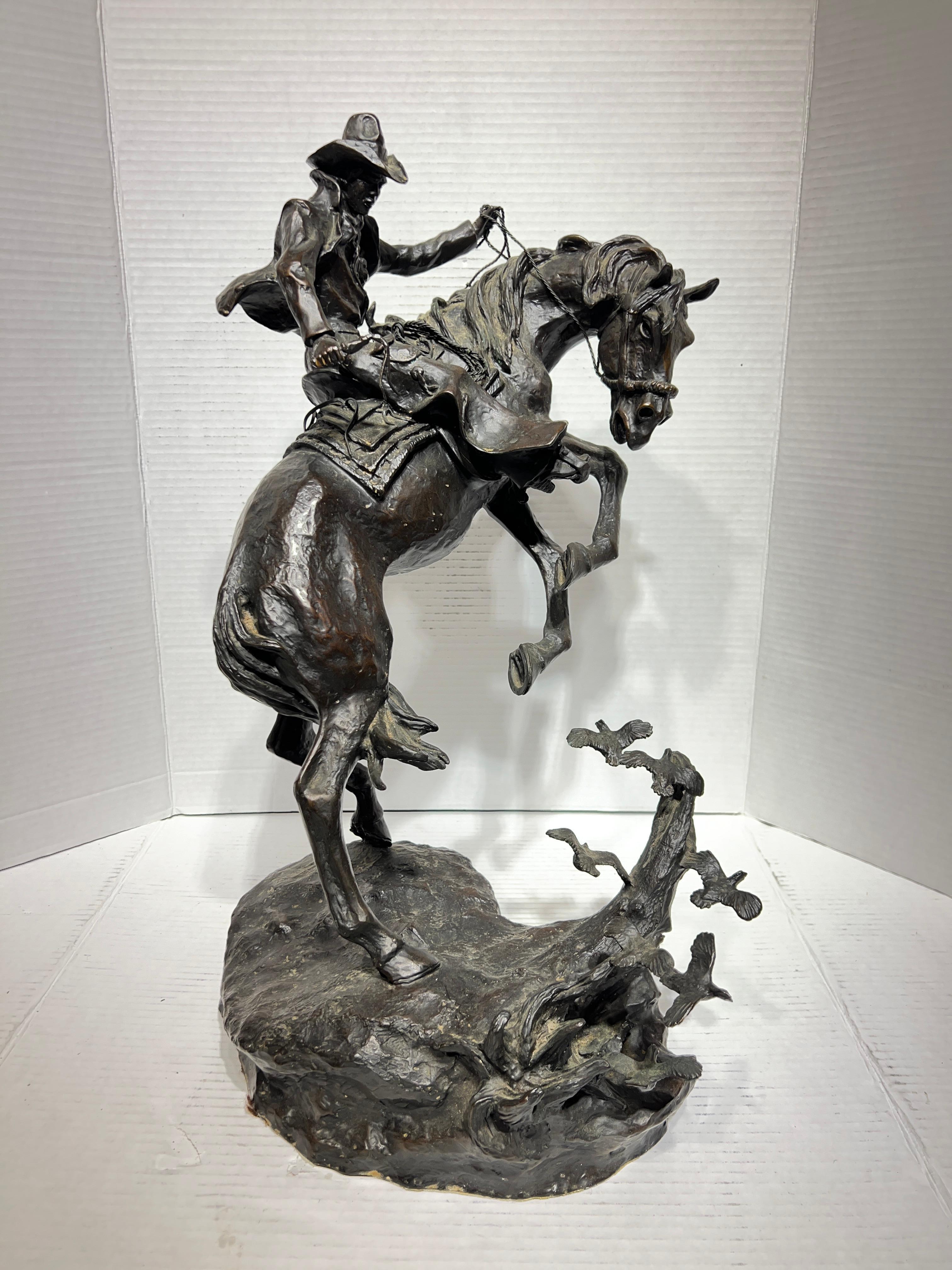 Wonderful patinated bronze sculpture by Ken Payne (1938-2012) depicting a cowboy on horseback, startled from a flock of birds.  Number 111 from a limited edition of 750.  Signed and dated 1983.  20 1/2 inches tall and in good condition.