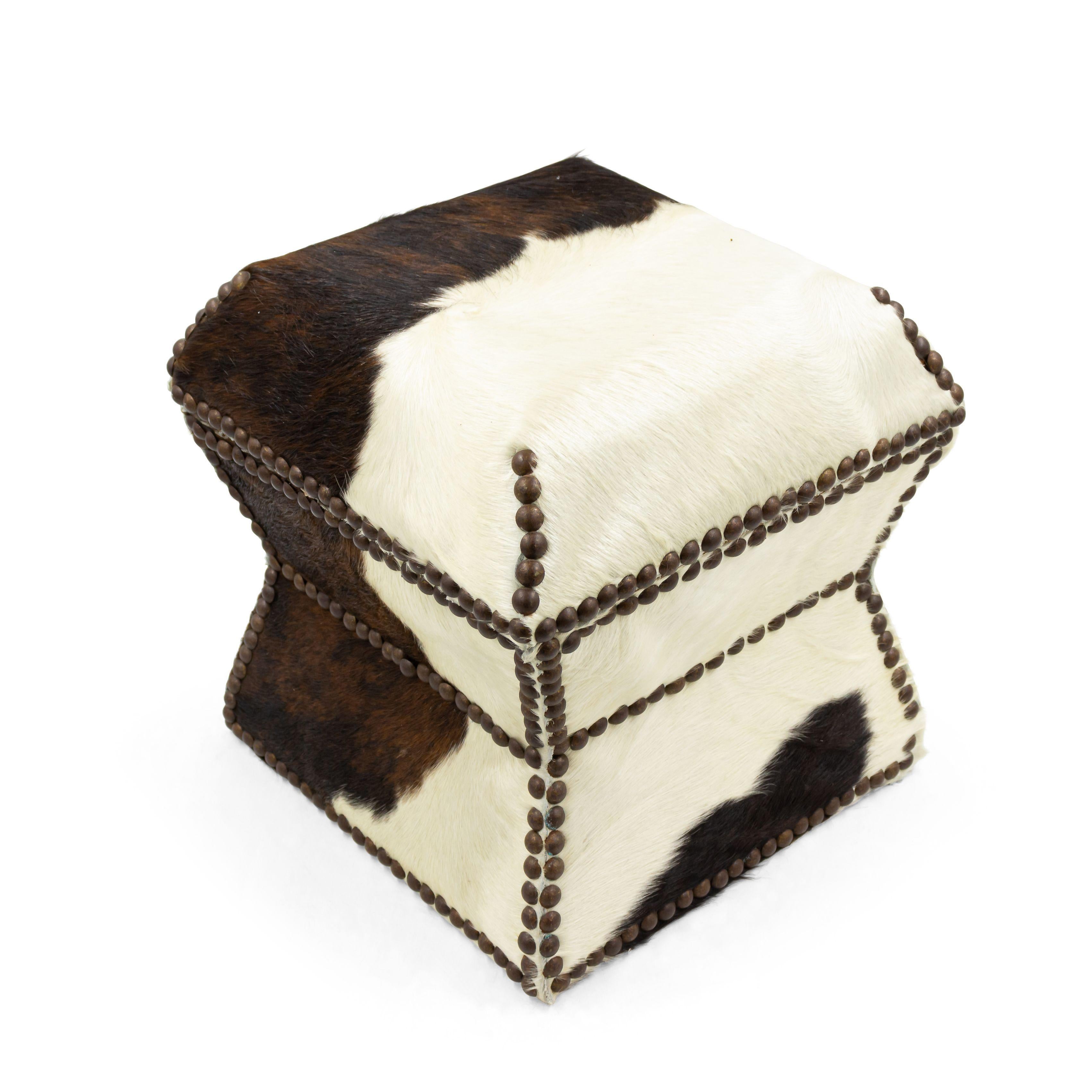 American cowhide upholstered box with brass nail heads.
  