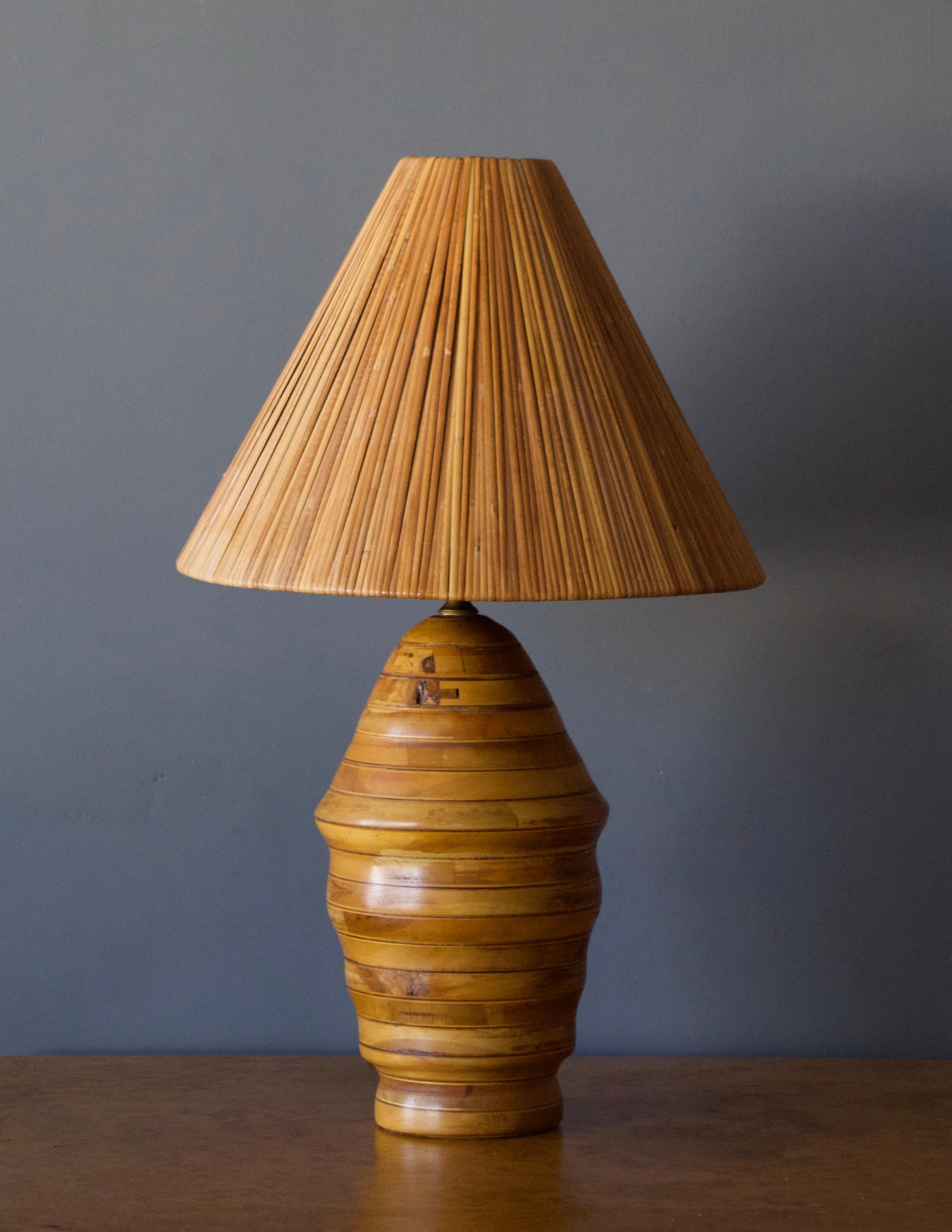 A table lamp. In finely carved oak in abstract form. Designed and produced by unknown studio craftsman. Presents with beautiful original patina to wood and brass.

Sold with lampshade. Stated dimensions including lampshade as is