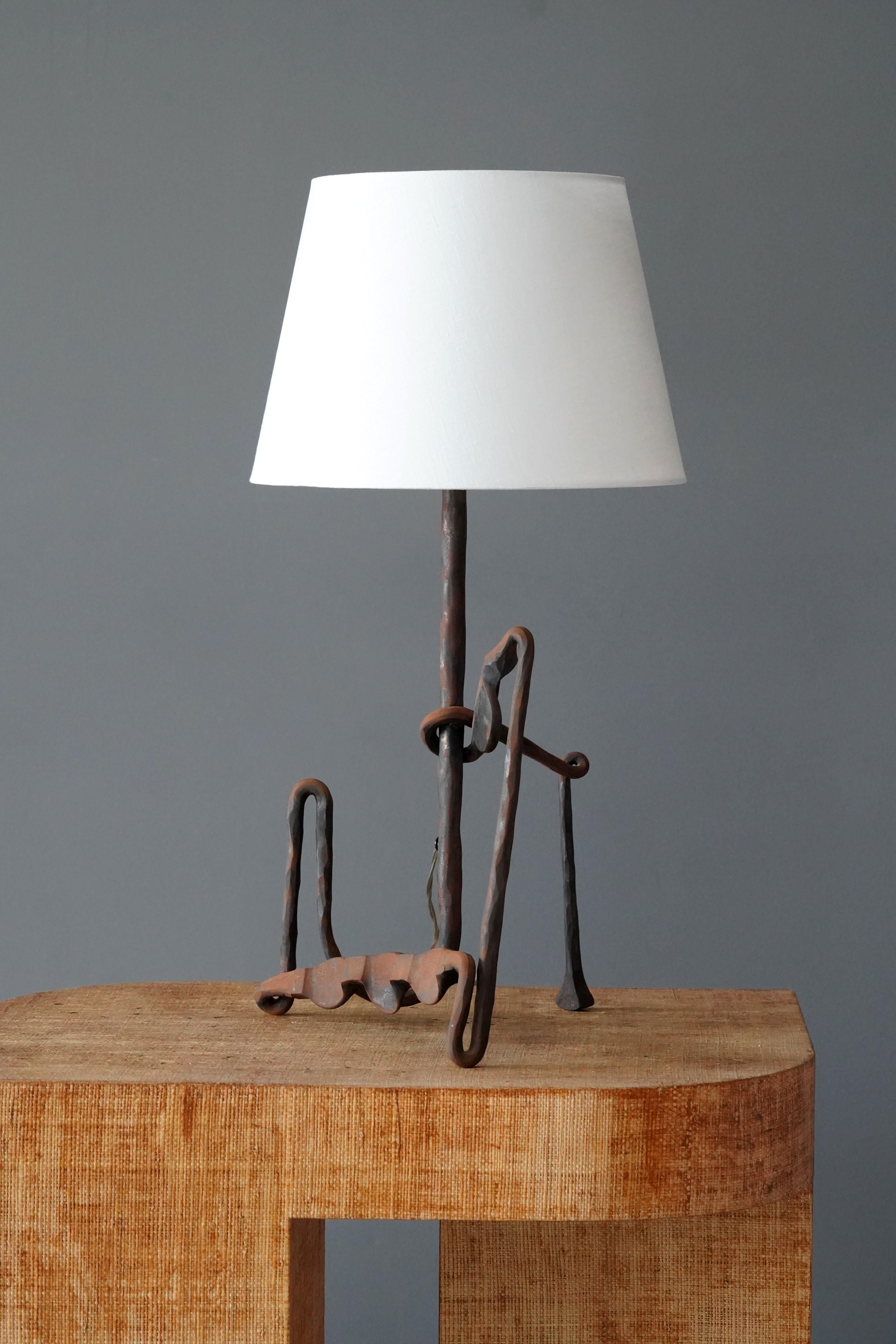 A table lamp. In hand-sculpted Iron. By unknown studio craftsman.

Sold without lampshade. Stated dimensions excluding bulbs and lampshade.

Other designers of the period include Alexandre Knoll, George Nakashima, Isamu Noguchi, J.B. Blunk and