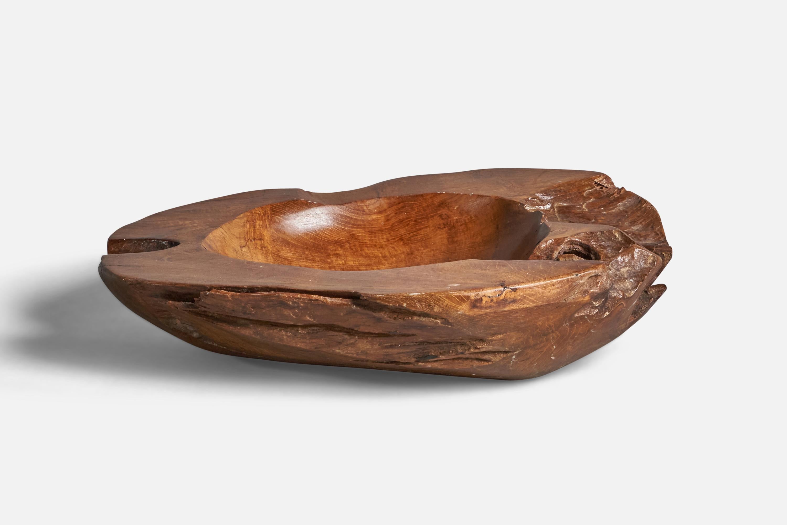 A sizeable freeform walnut bowl designed and produced in the US, c. 1960s.