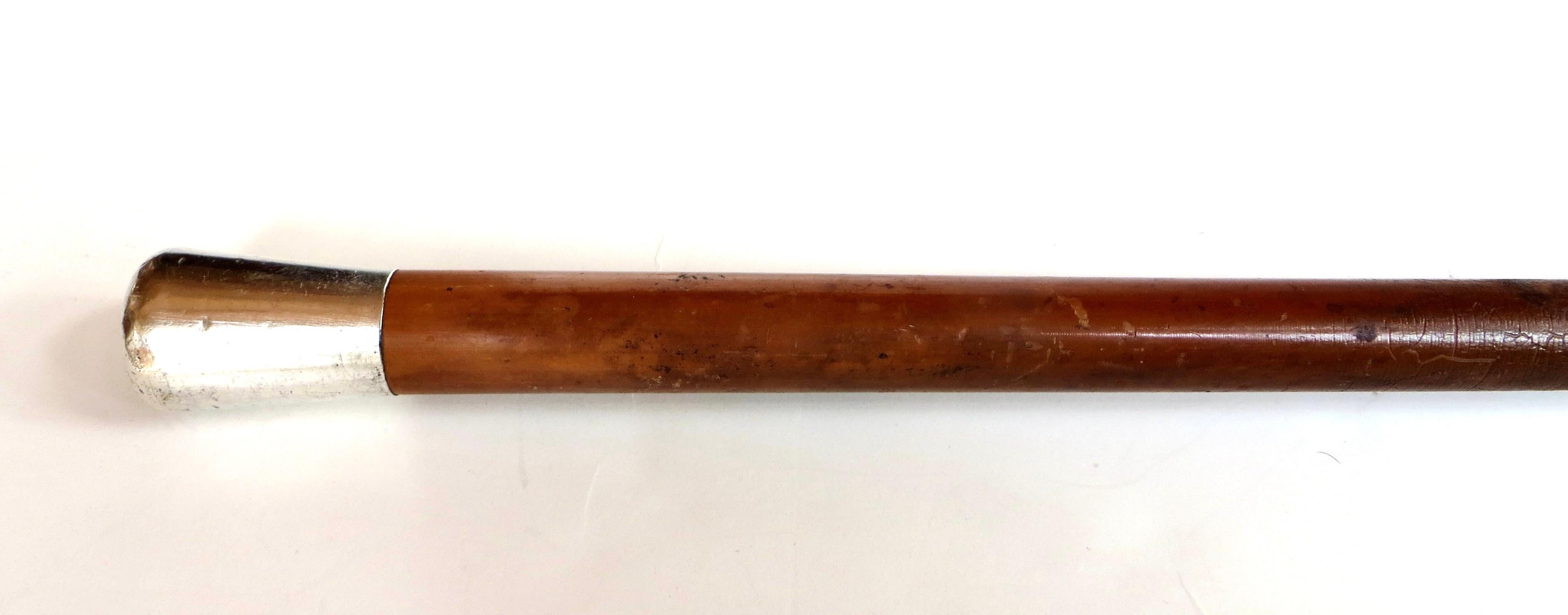 Victorian American cane is of the straight stick like variety with a wooden shaft, probably of pine, with a sterling silver collar (handle) marked 