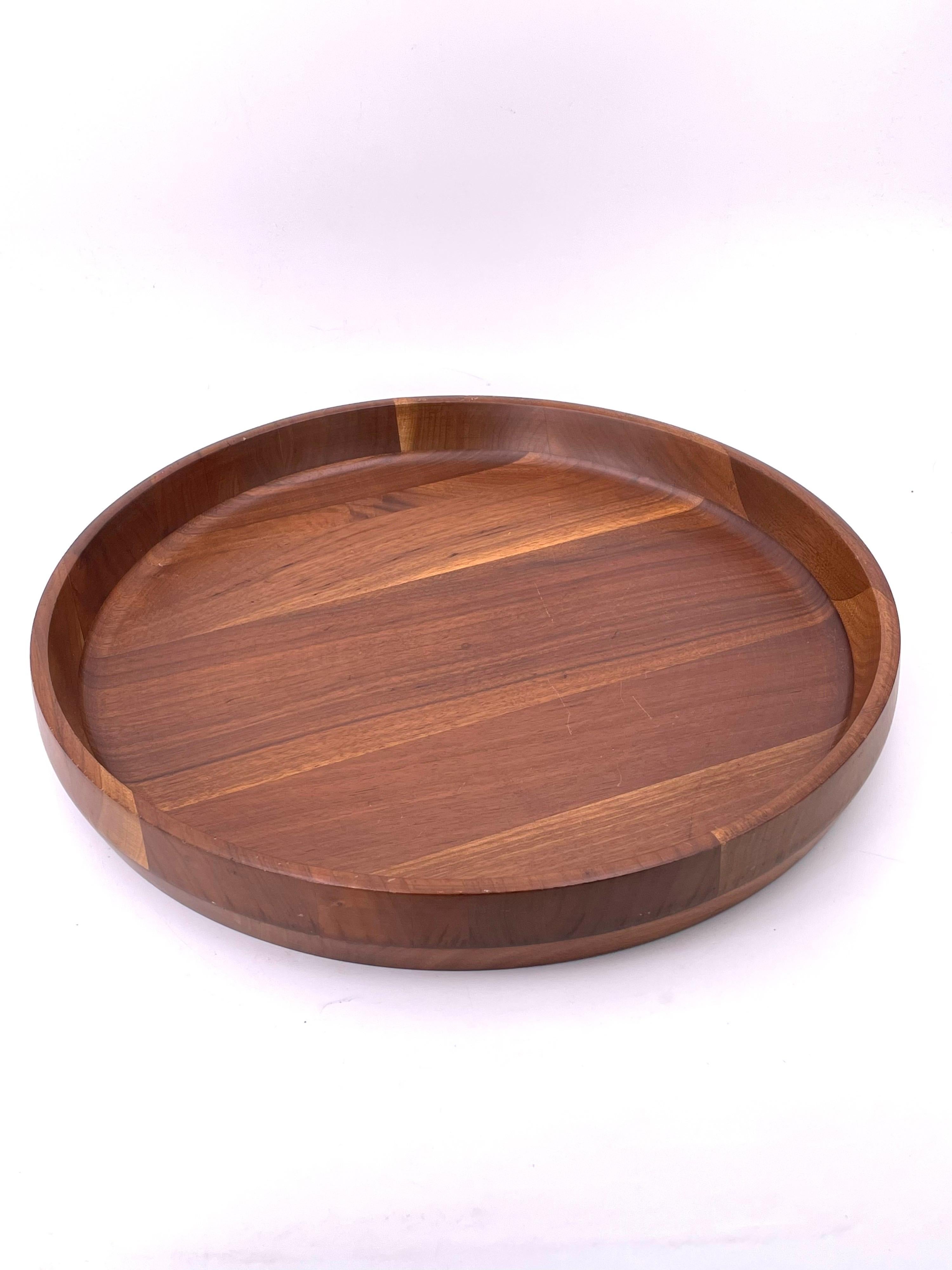 Beautiful solid walnut slanted round tray, with a raised edge by Kustom Kraft great condition, circa 1950's.