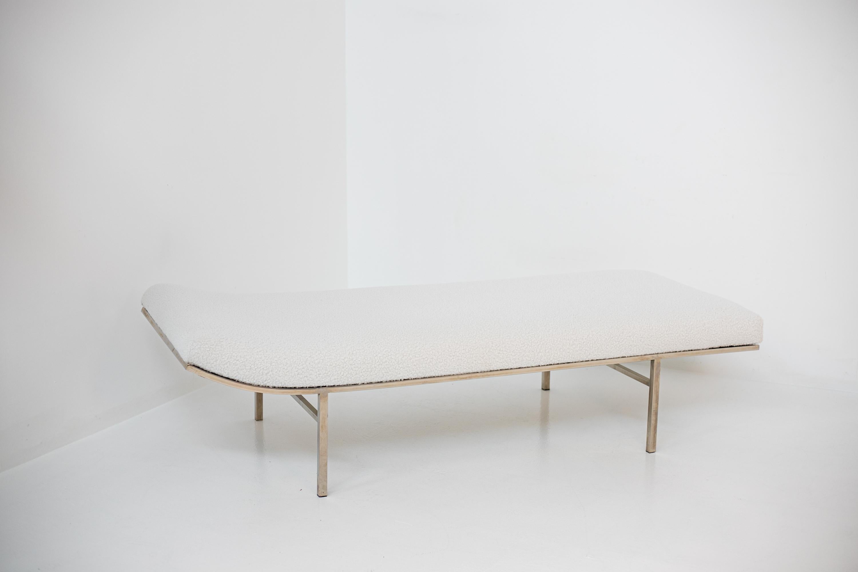 A sleek and extremely comfortable design, this chaise or daybed by Jules Heumann for Metropolitan has a long, low body padded with box tufting and a slightly raised end supported by a chrome-plated steel frame. The daybed is ideal for elegant or