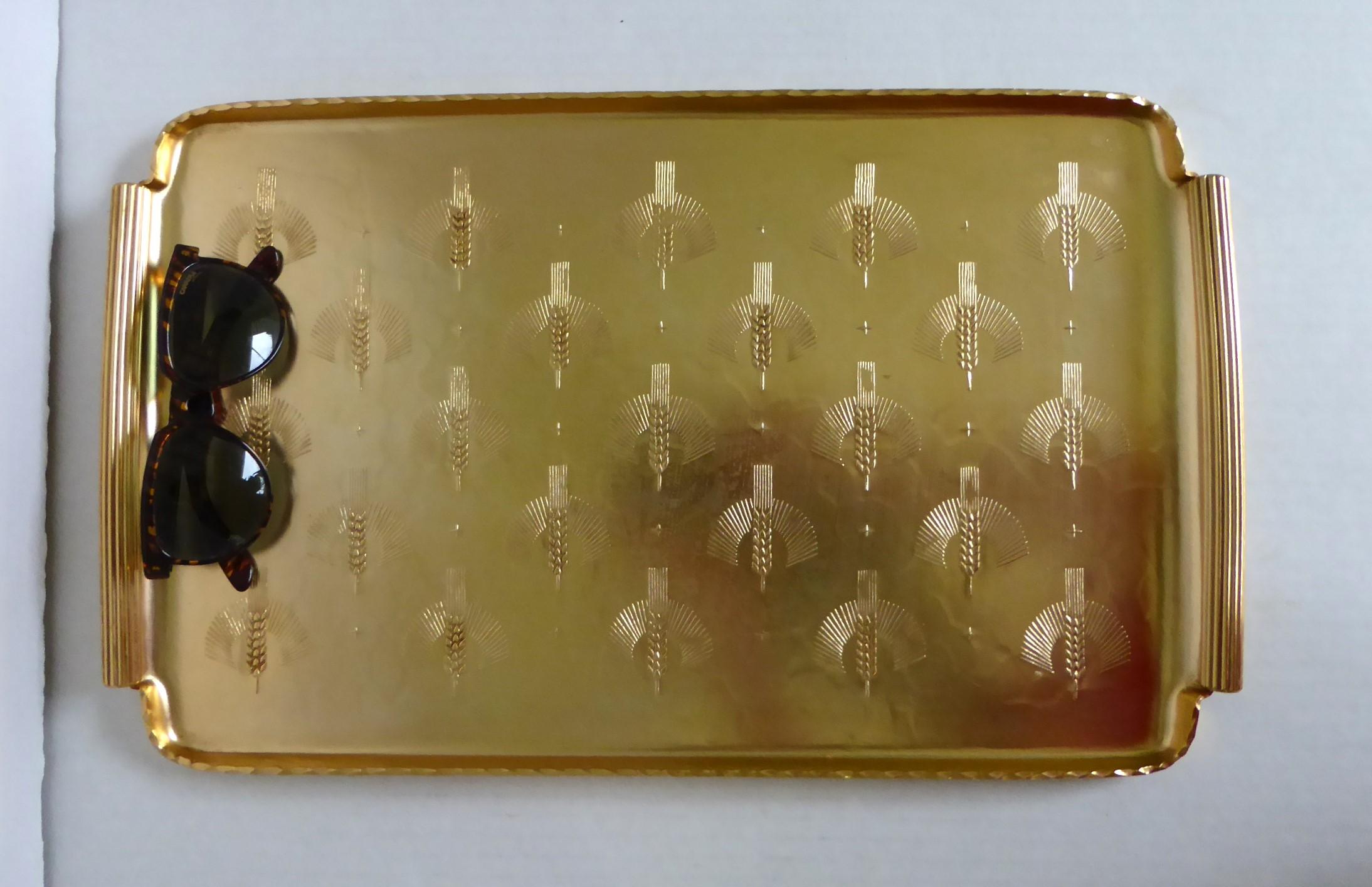 Elegant and useful hand wrought anodized aluminum gold tray by Arthur Armour from the 1950s.  Sporting a repeating formal Wheat pattern.
The Arthur Armour Hand Wrought Aluminum Co. was founded in Grove City, Pennsylvania in 1933 and was in existence