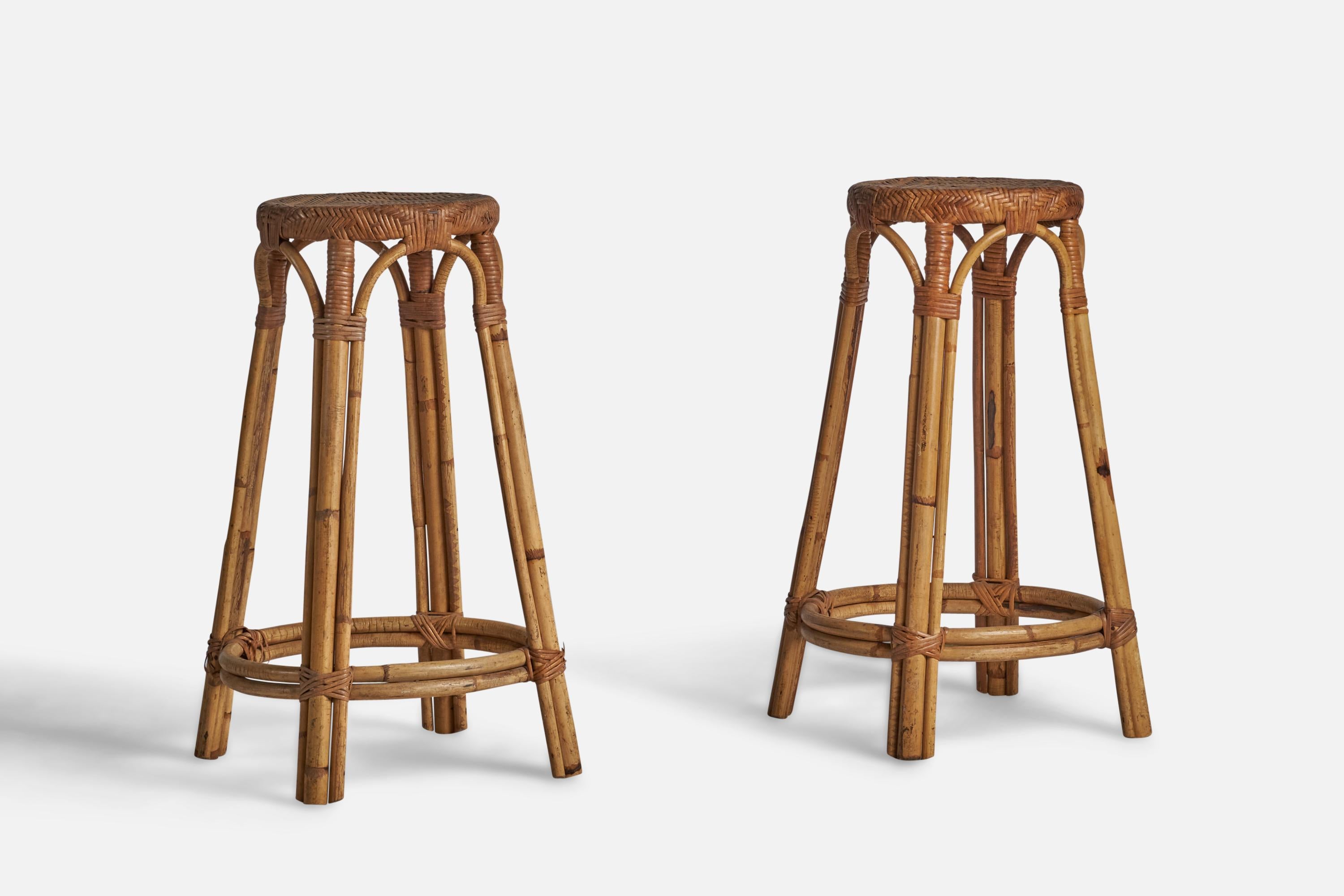 A pair of bamboo and rattan bar stools designed and produced in the US, 1950s.