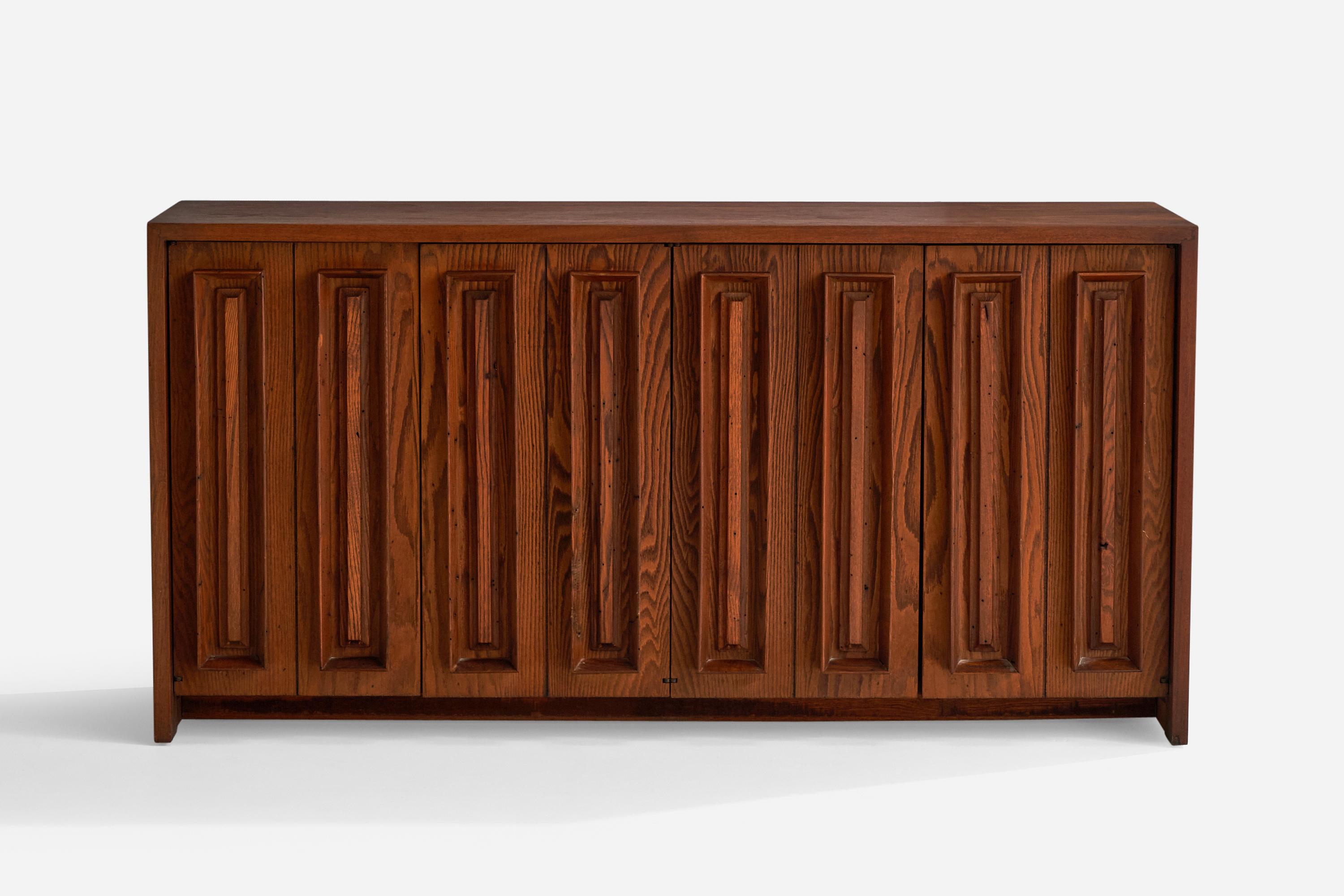 A stained pine and walnut cabinet designed and produced in the US, 1950s.