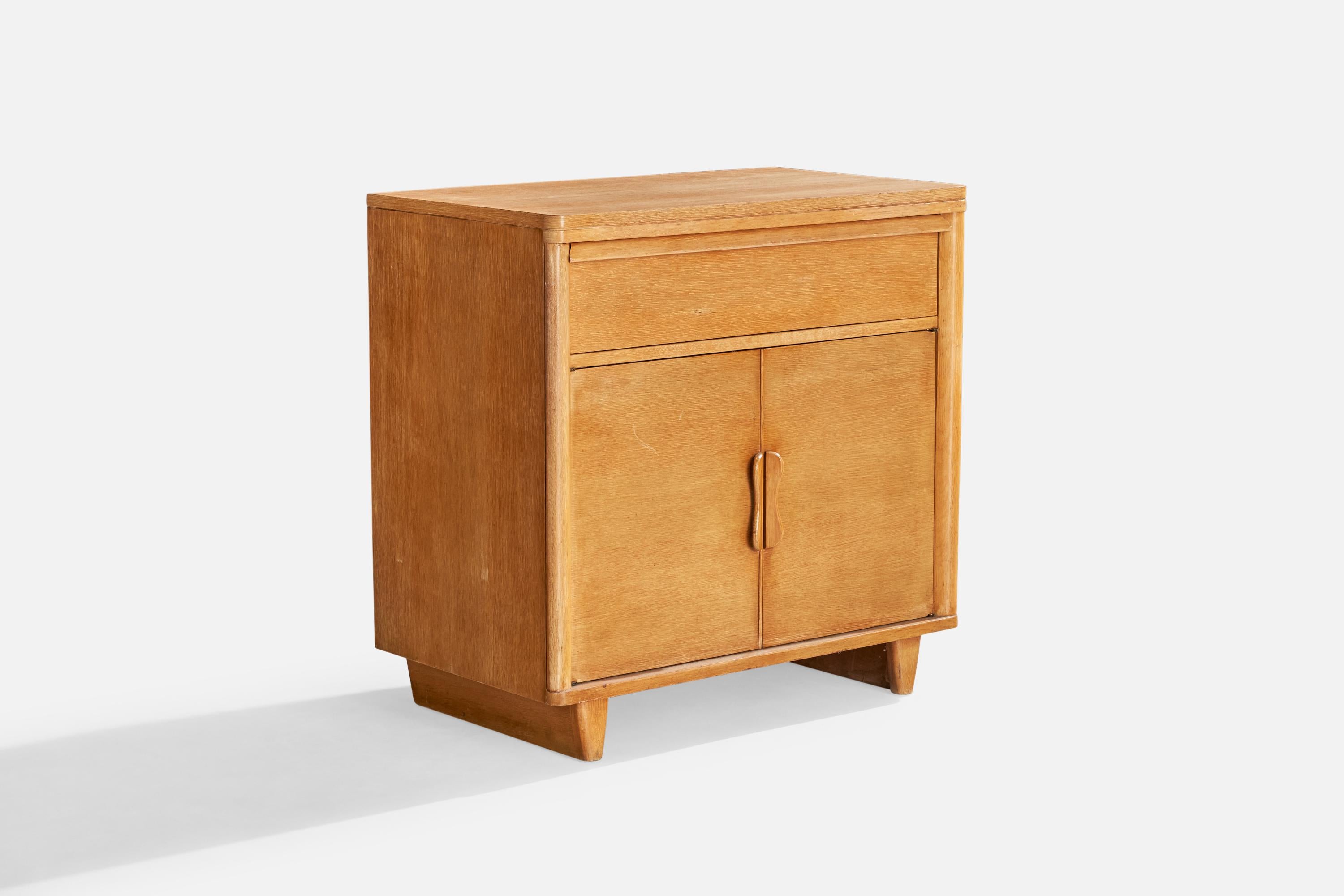 A wood cabinet designed and produced in the US, c. 1940s.

Dimensions: 32.75” H x 33” W x 19.25” D