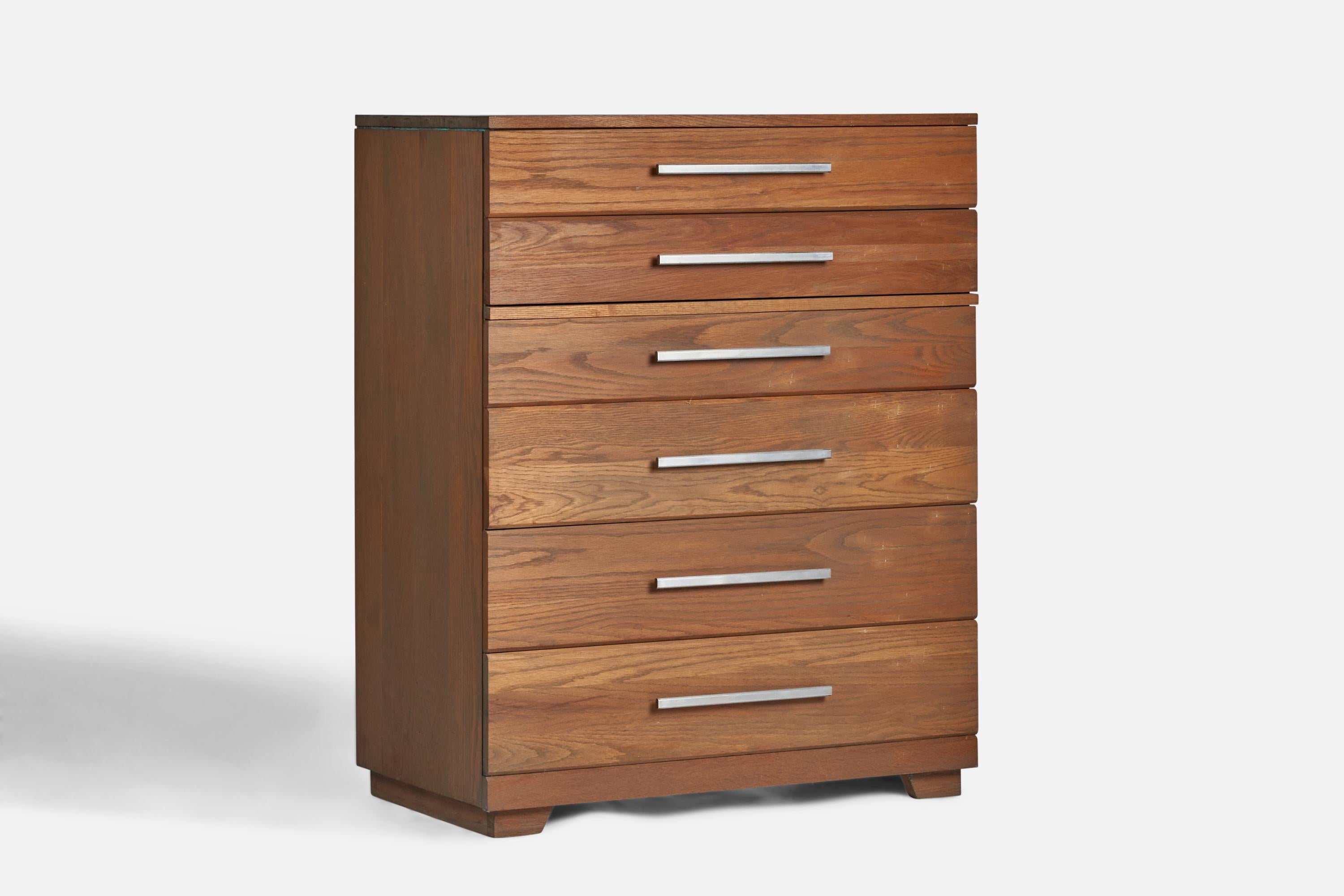 A stained oak and metal chest of drawers designed and produced in the US, 1950s.