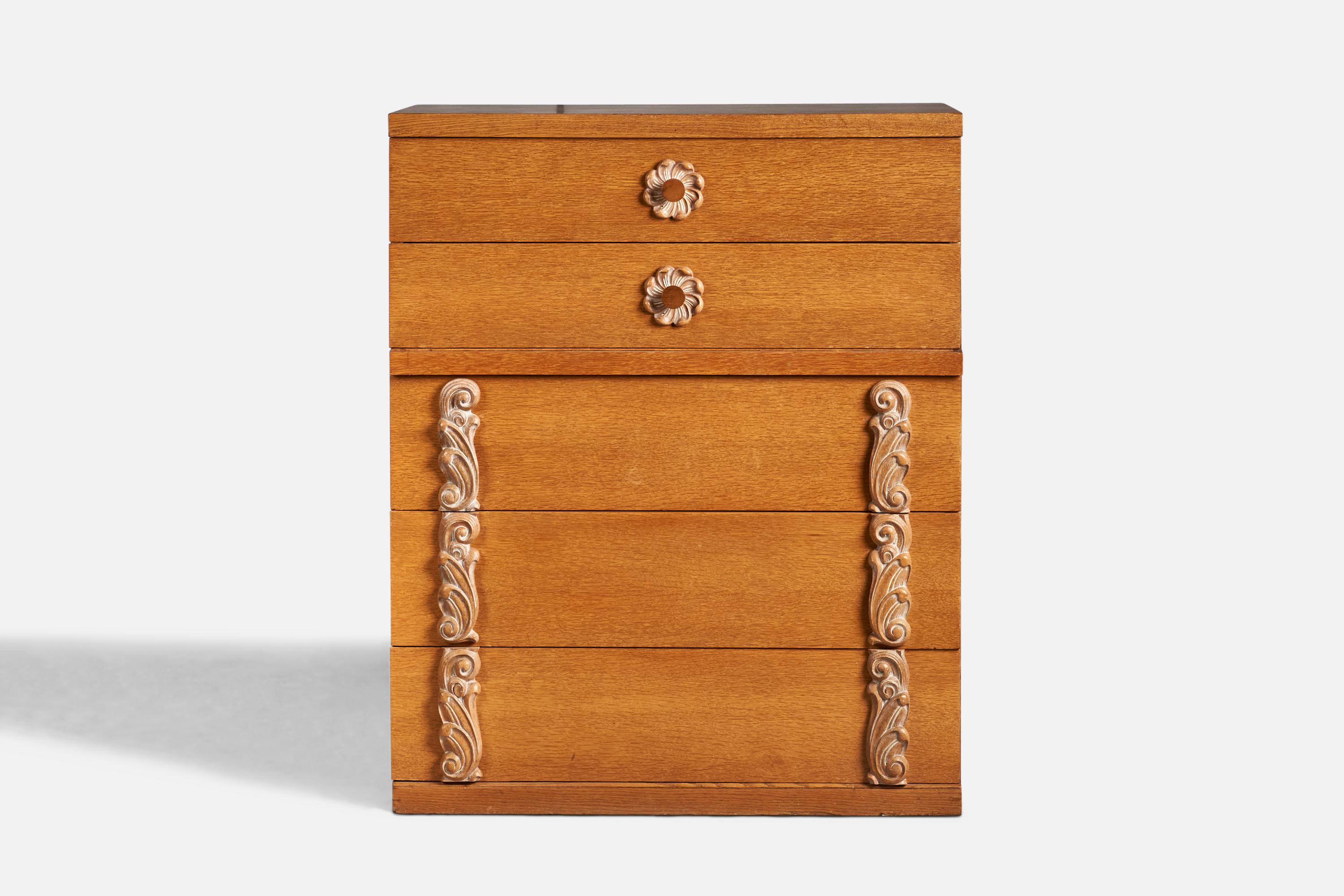 An oak chest of drawers with cerused detailing designed and produced in the US, c. 1940s.