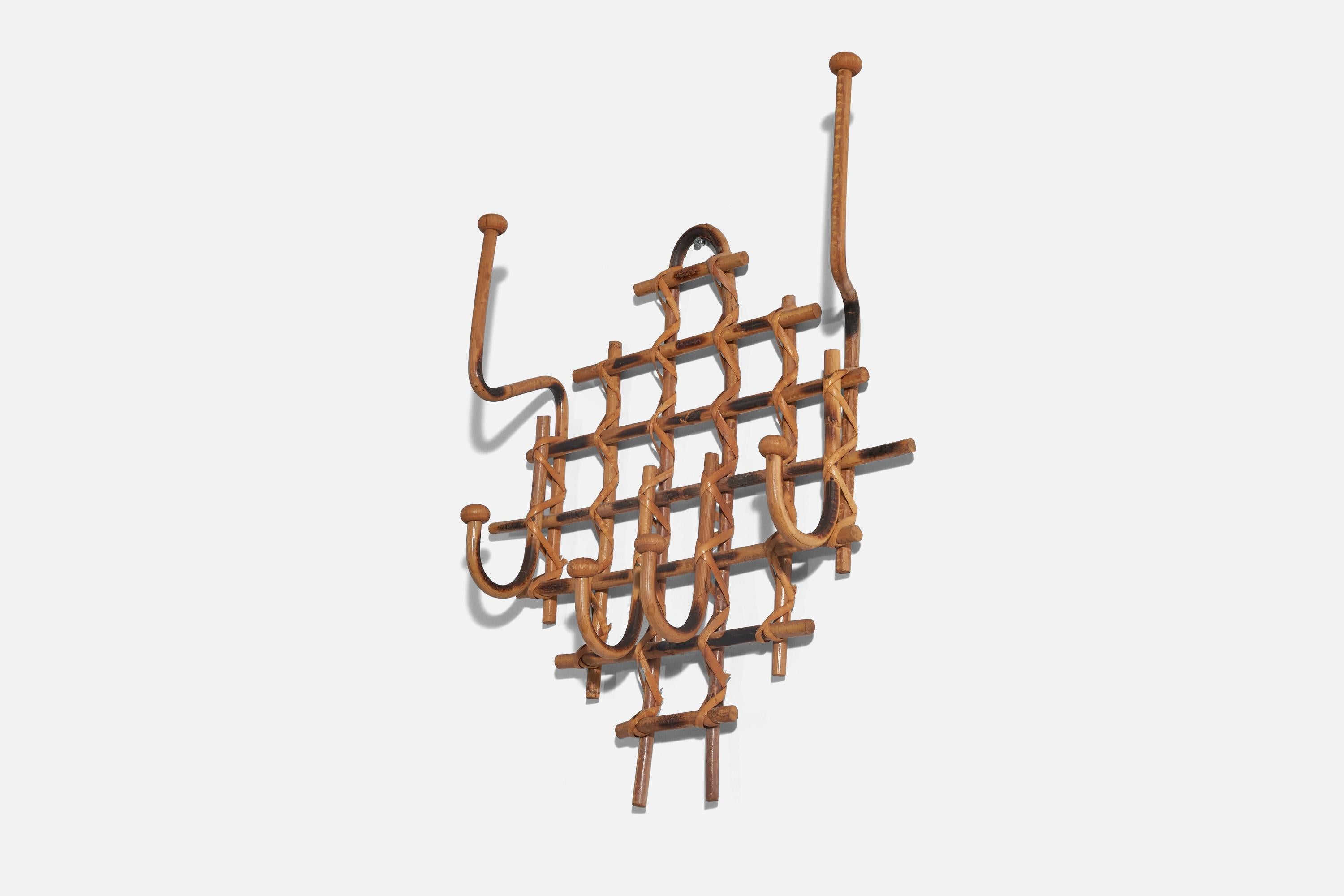 A rattan and bamboo coat rack designed and produced by an American designer, USA, 1950s.
 
