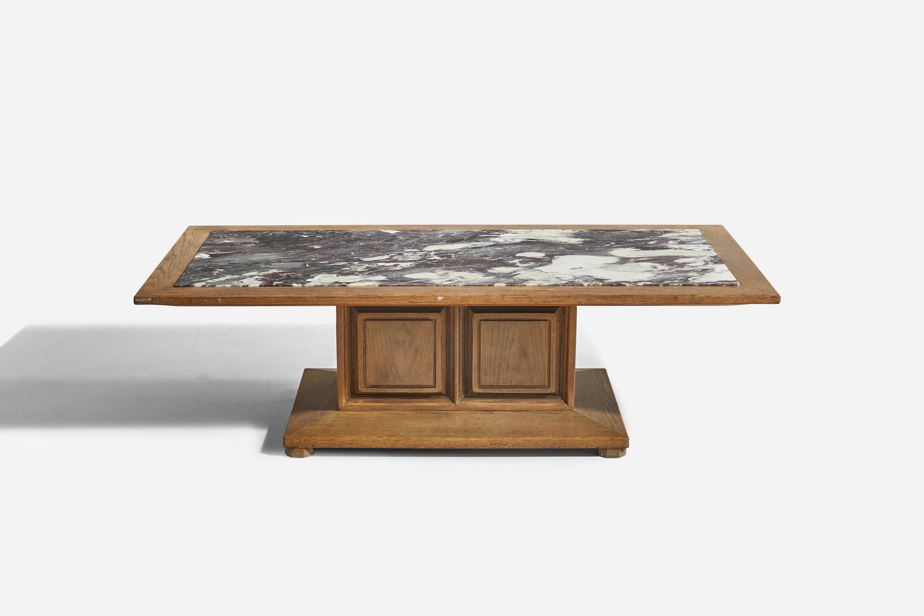 A marble and oak coffee table designed and produced by an American designer, United States, c. 1940s.
 
