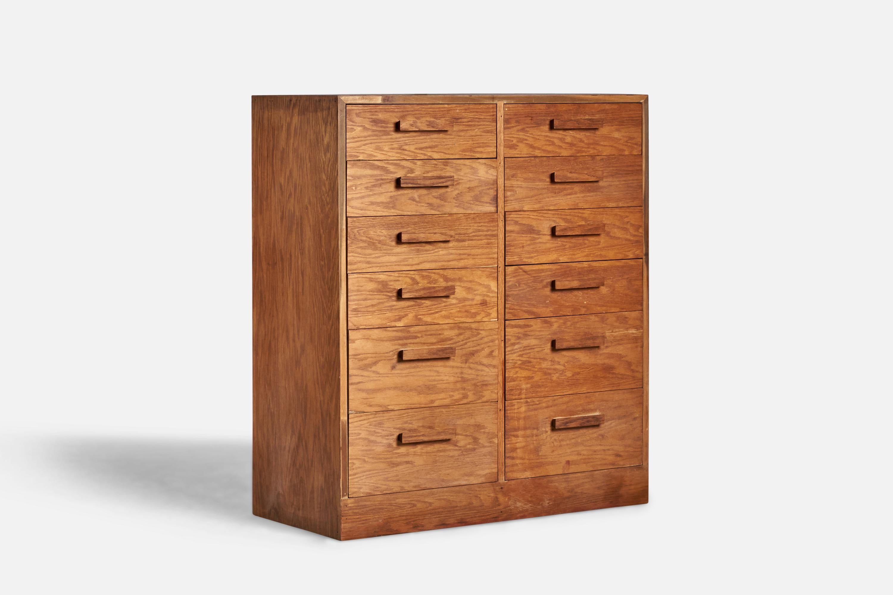 A stained oak dresser designed and produced in the US, c. 1930s.