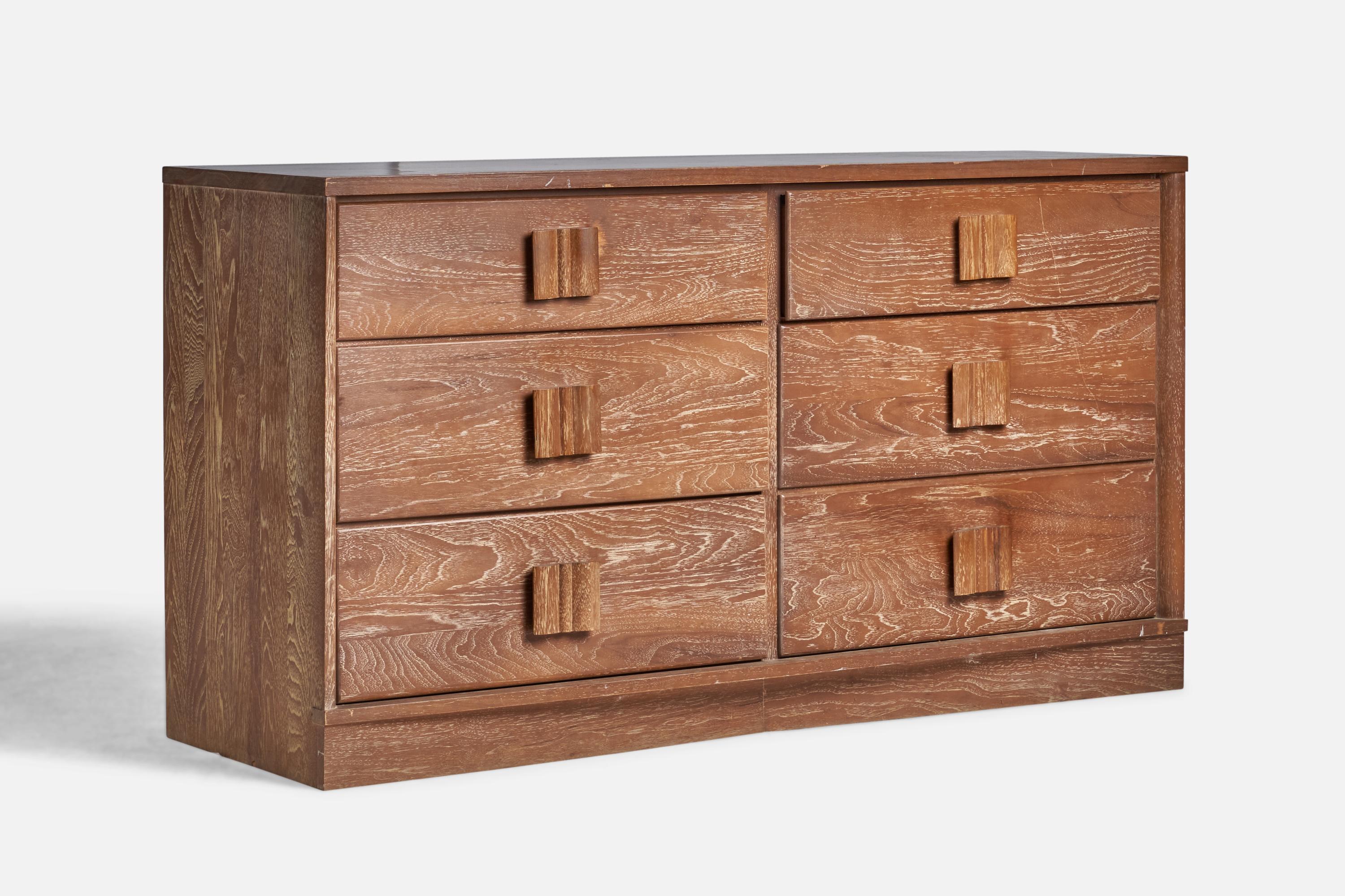 A cerused oak dresser designed and produced in the US, 1940s.