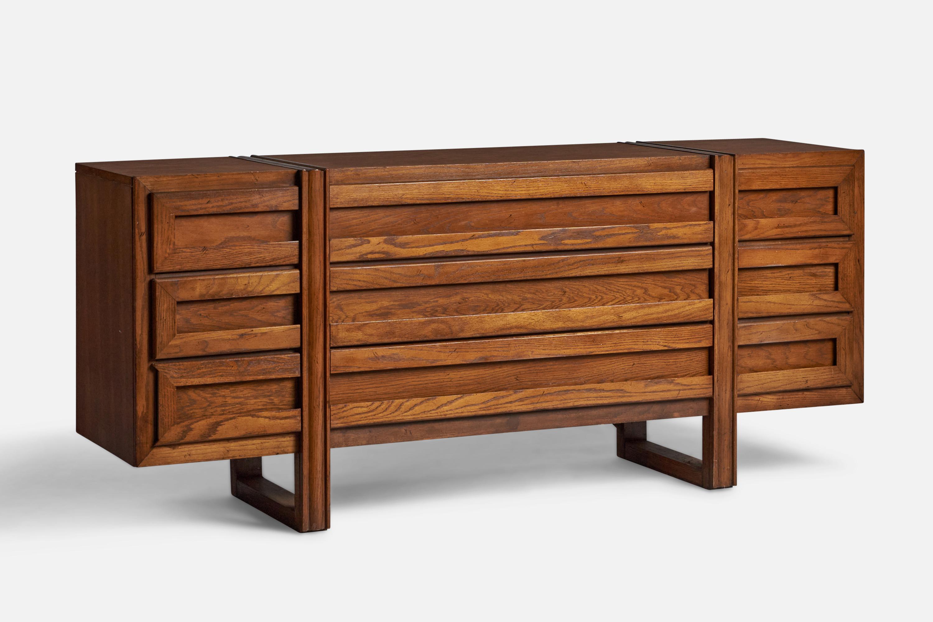 A stained walnut dresser or commode designed and produced in the US, 1950s.
