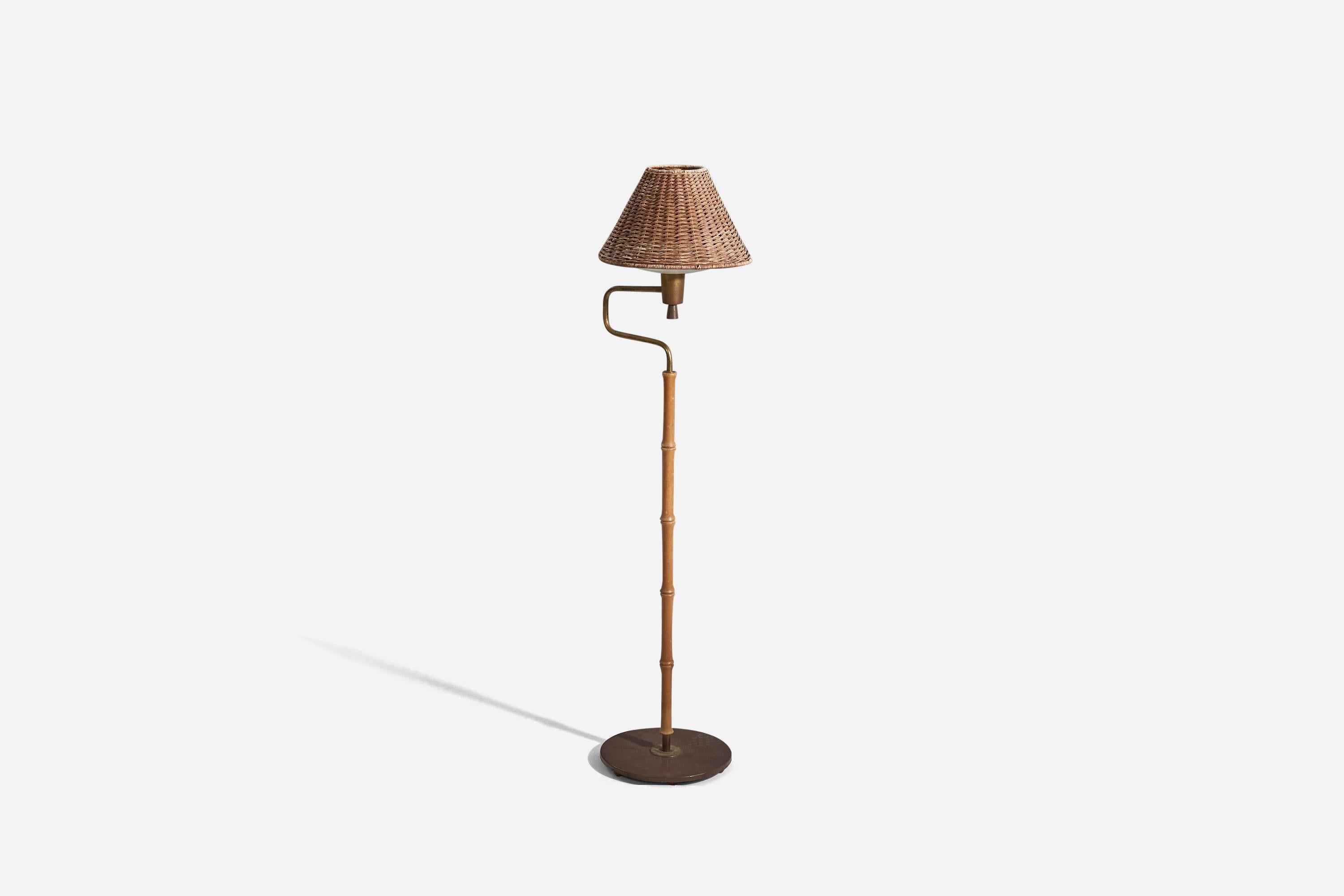 A lacquered metal, brass, wood, rattan, acrylic floor lamp designed and produced by an American designer, USA, 1950s.
  
Sold with lampshade. 
Stated dimensions refer to the floor lamp with the shade. 
Variable dimensions, measured as