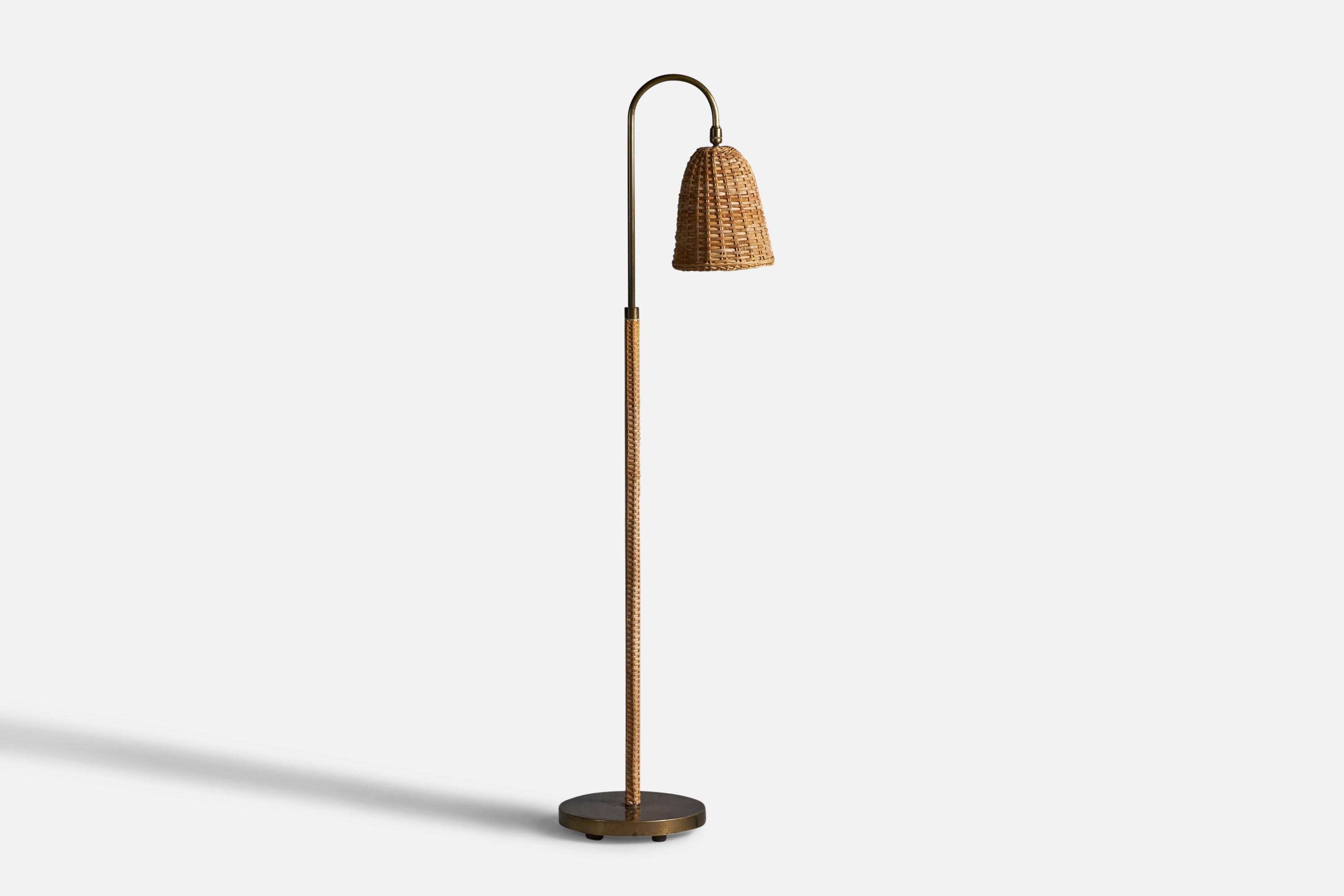 A rattan and brass floor lamp, designed and produced in the US, 1950s

Overall Dimensions: 51
