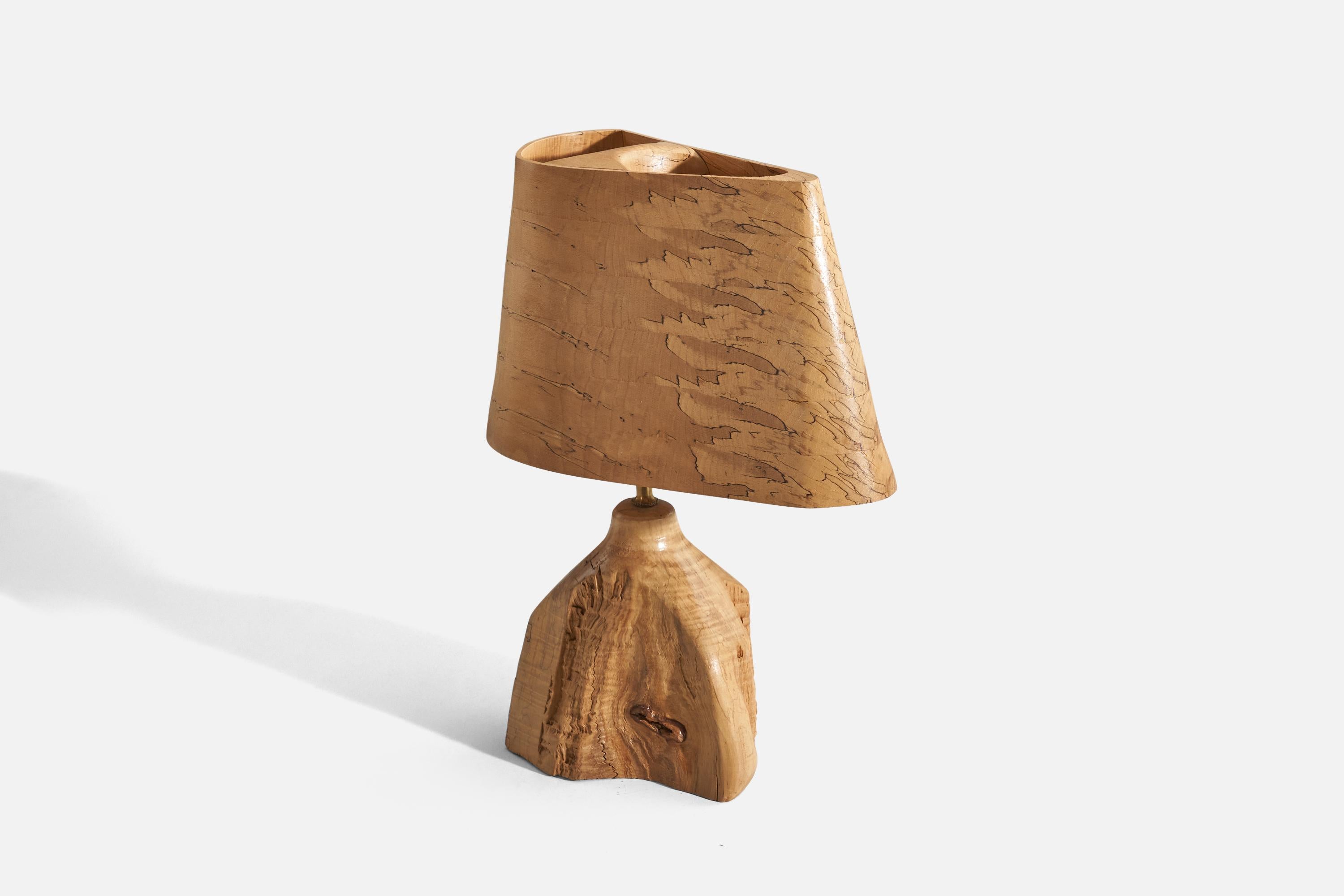 A brass and wood free form table lamp, designed and produced in the United States, c. 1950s. 

