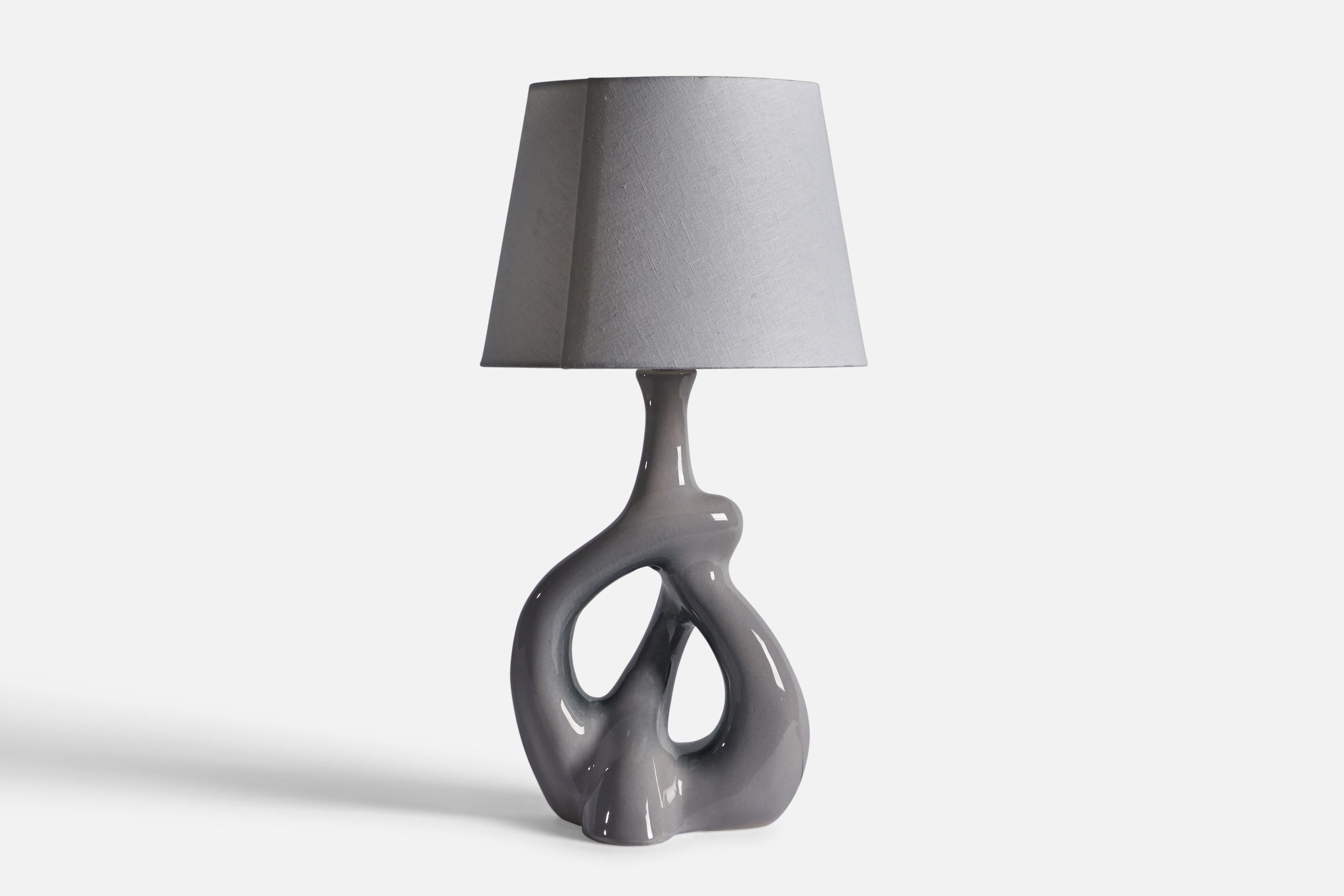 A grey-glazed ceramic freeform table lamp, designed and produced in the US, c. 1950s.

Dimensions of Lamp (inches): 23.5