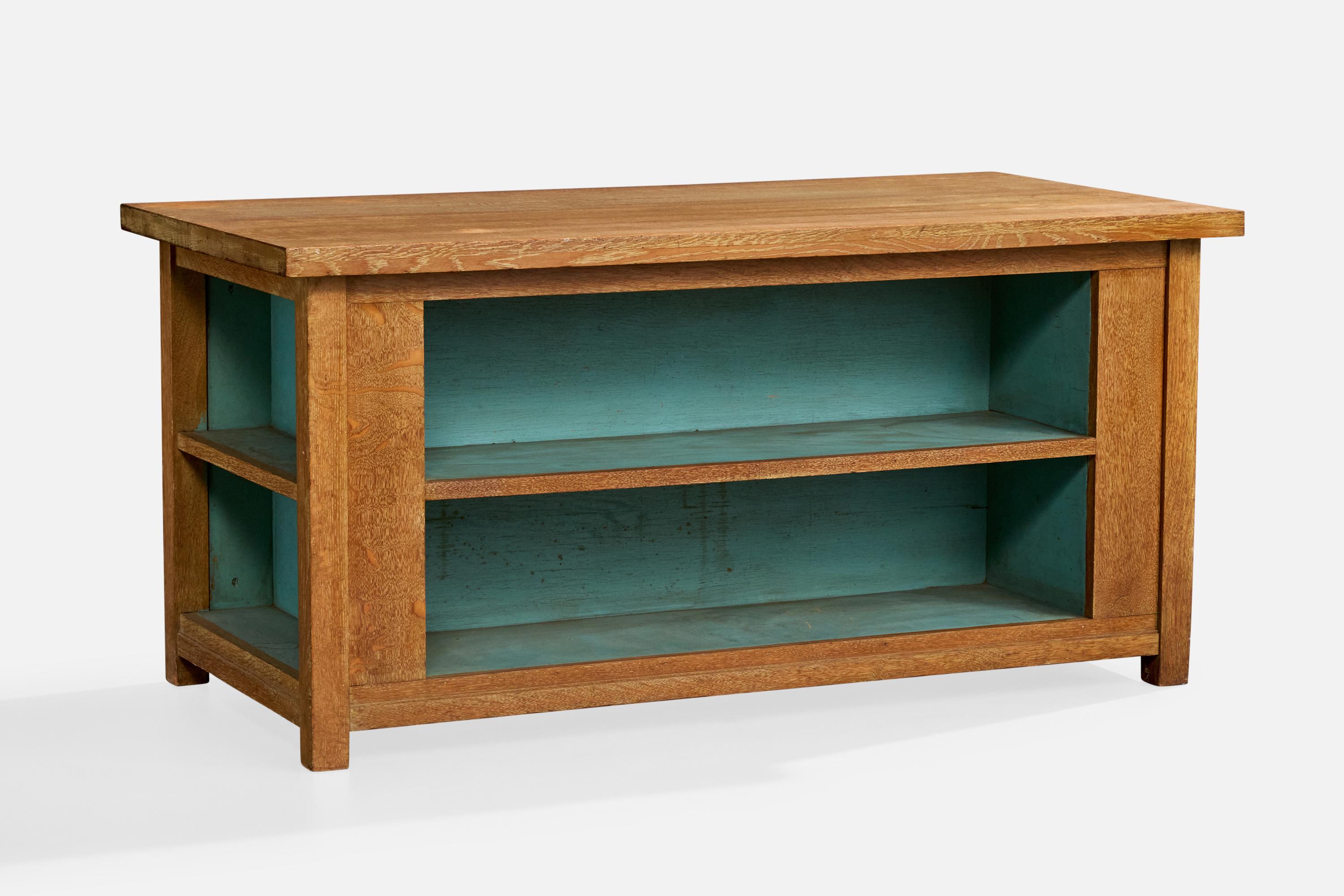 A blue-painted oak library table or center table in the Arts and Crafts style designed and produced in the US, c. 1910s.

Many areas of wear present and a large crack near one bottom corner. 

Overall Dimensions (inches): 29.0