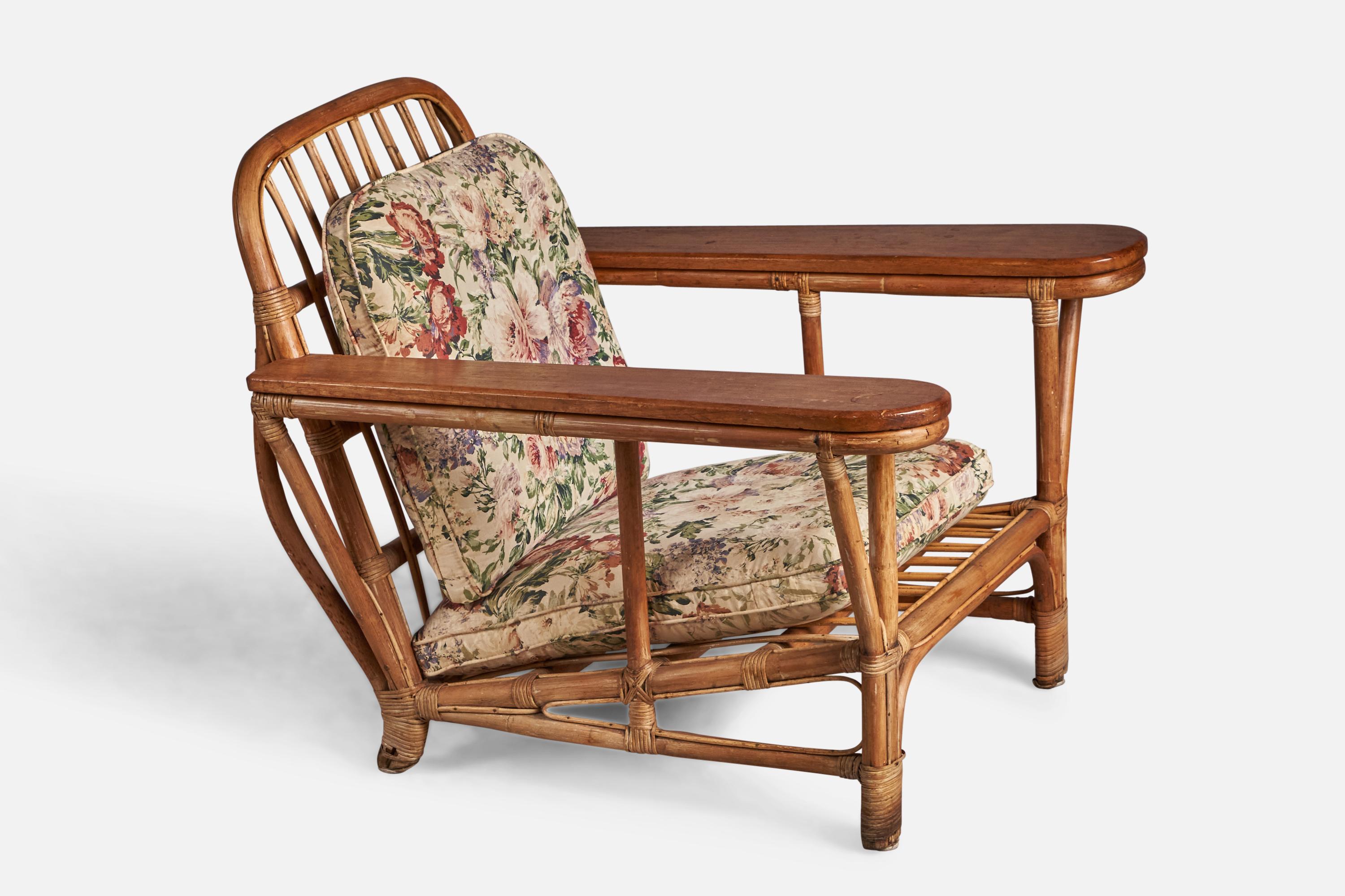 A bamboo, rattan, teak and floral-printed vintage fabric lounge chair designed and produced in the US, 1950.

15” seat height