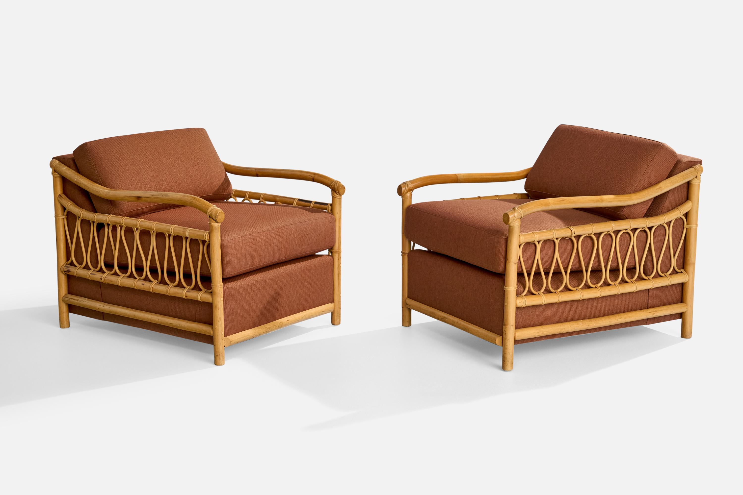 A pair of bamboo, rattan and red fabric lounge chairs designed and produced in the US, c. 1970s.

Dimensions: 29” H x 28” W x 36.3” D

Seat Height: 18.5” 